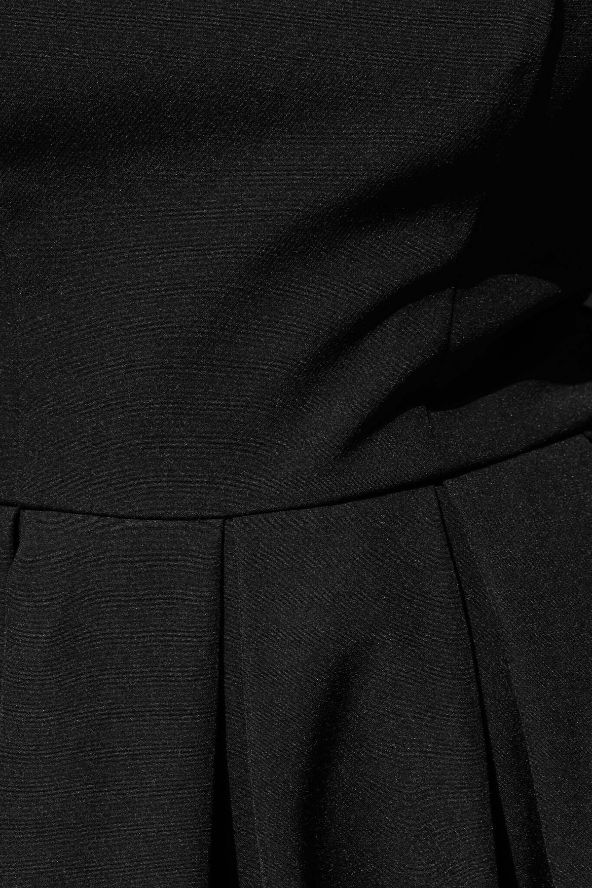 Close-up of the Jhene Maxi Dress showcasing its elegant pleats and smooth fabric texture.