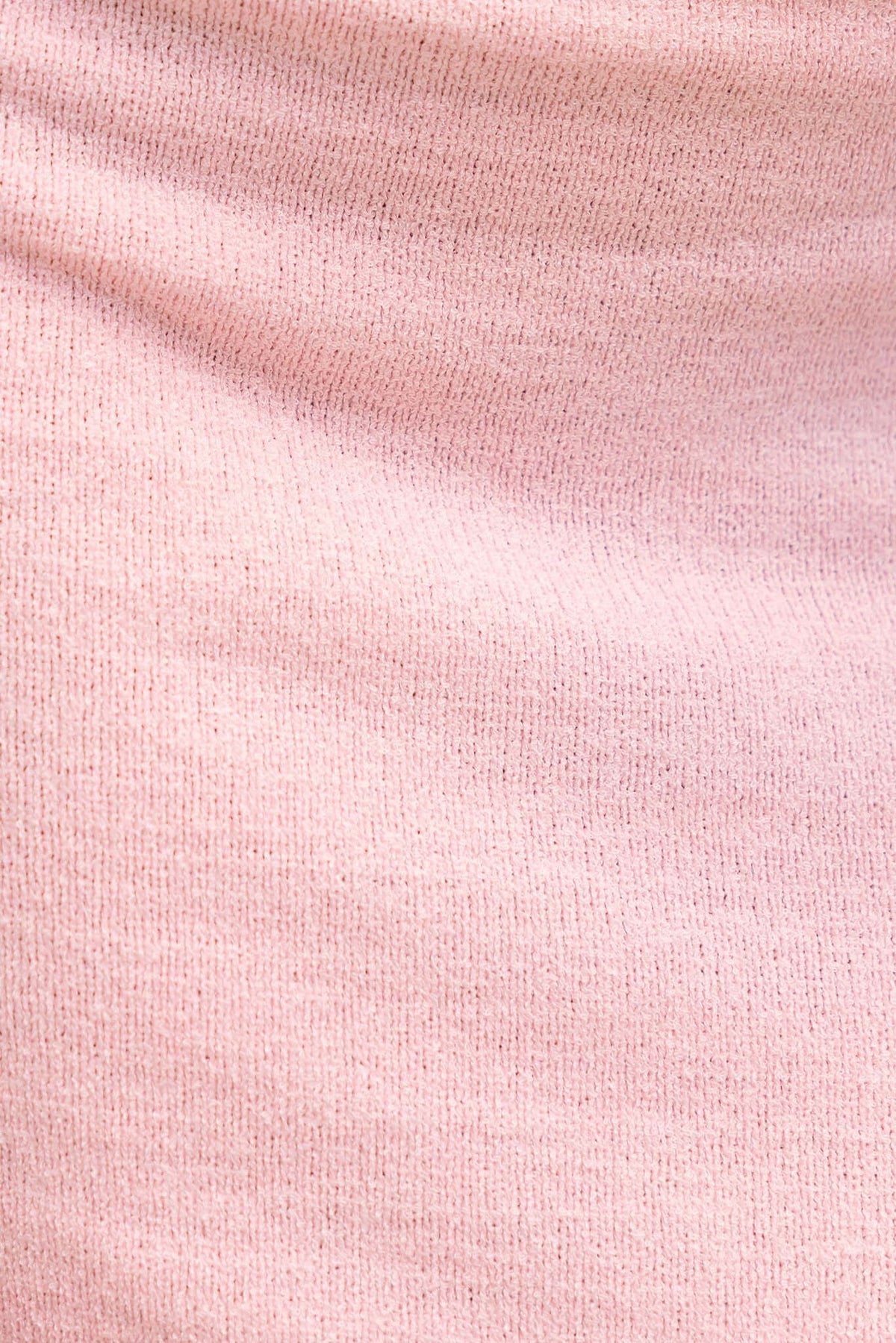 Close-up of soft pink knit fabric showcasing texture, ideal for a comfortable maxi dress.