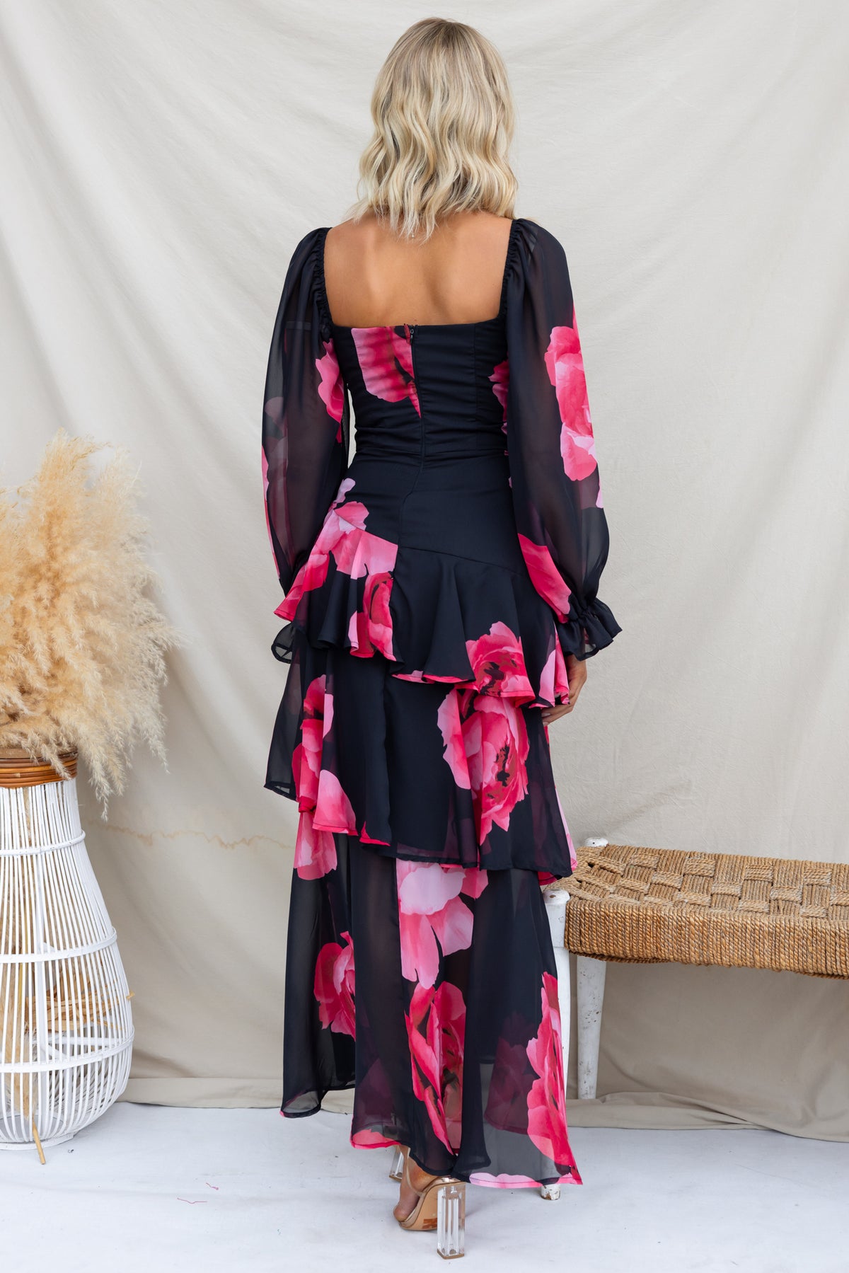 Back view of Kameryn Maxi Dress featuring floral print, flowing chiffon, and tiered layers for a stylish look.