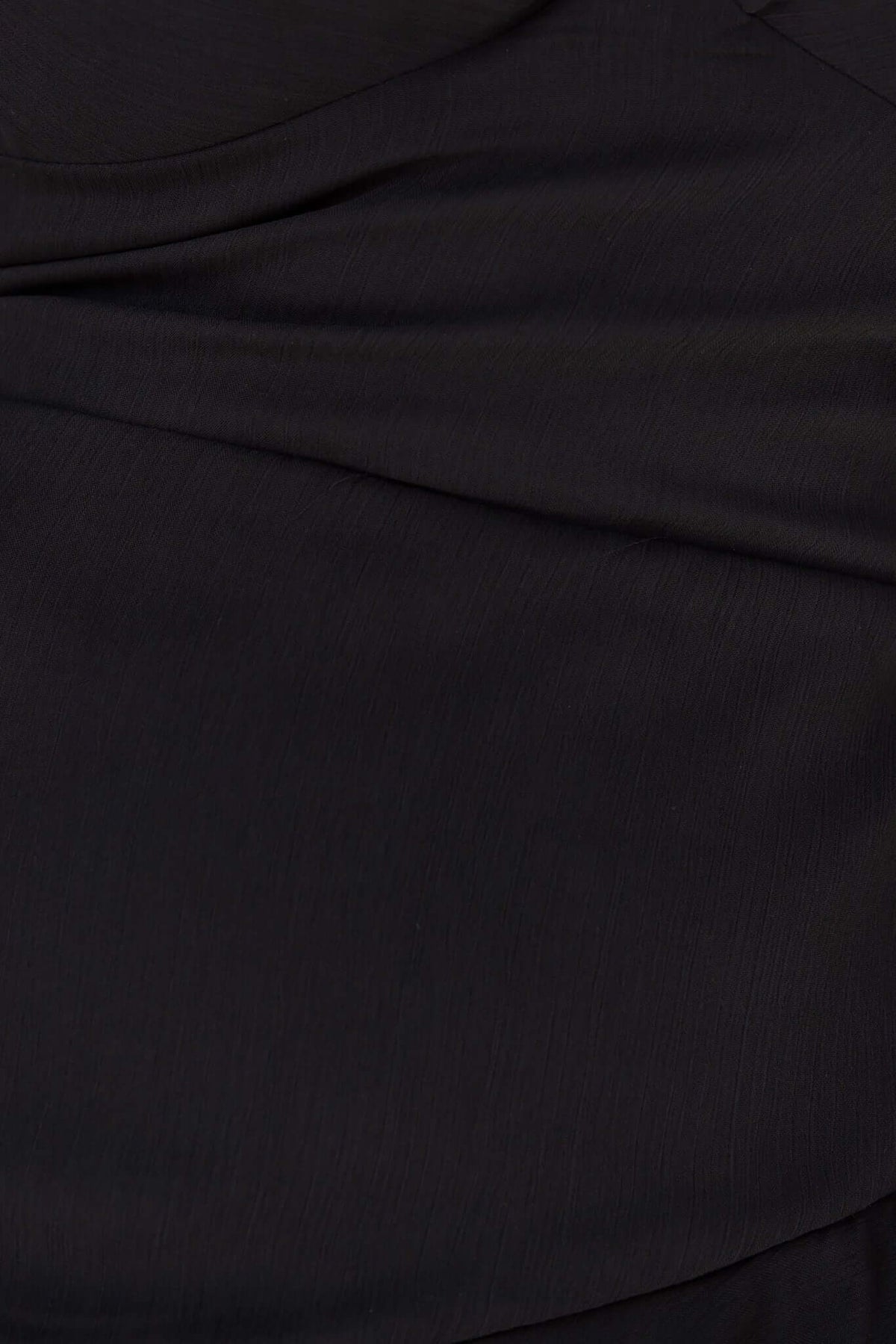 Close-up of black chiffon fabric showcasing smooth texture of Klaudia Maxi Dress.