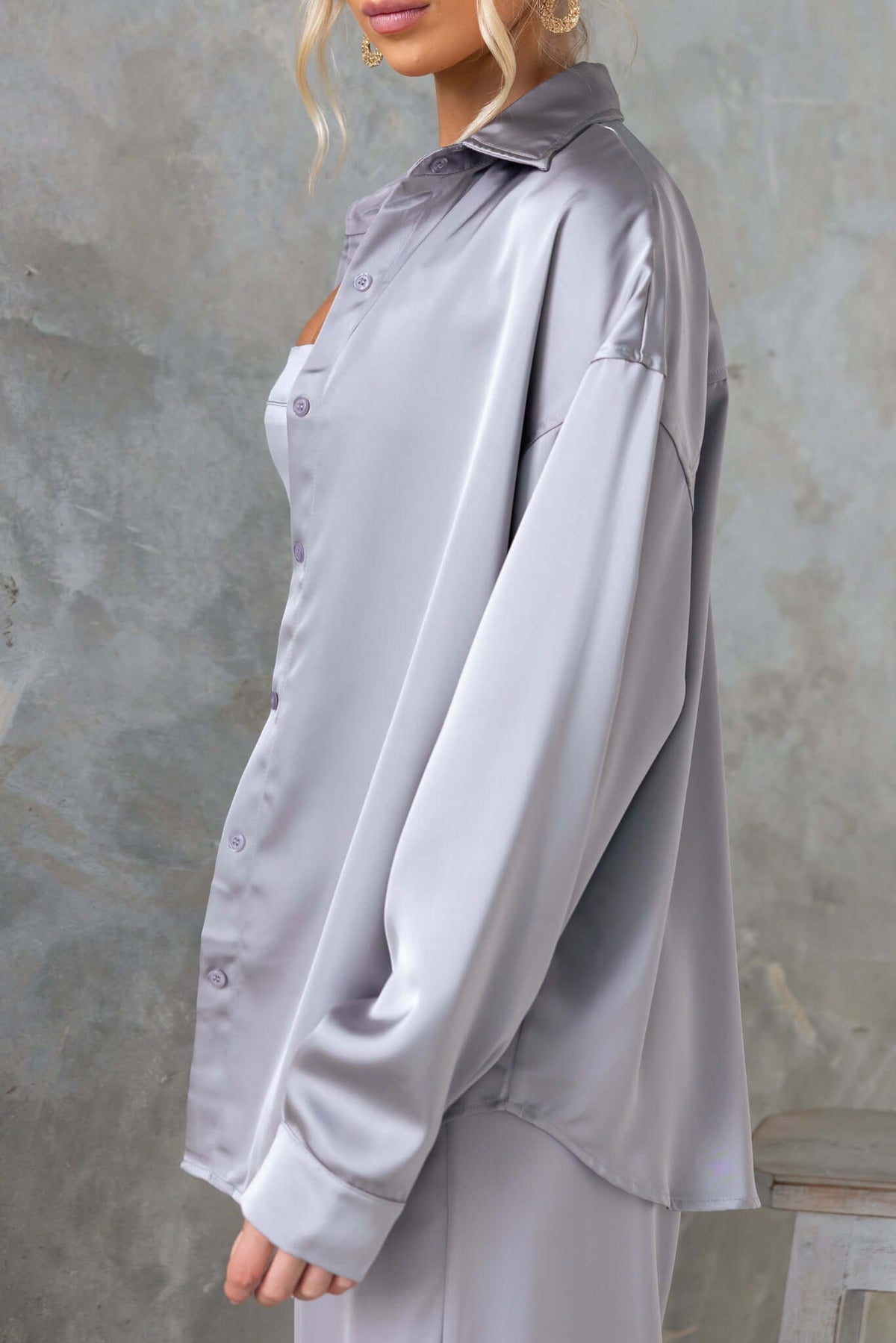 Kortez Shirt in satin material, featuring a button-up front and collar, worn by model, side view, relaxed fit.