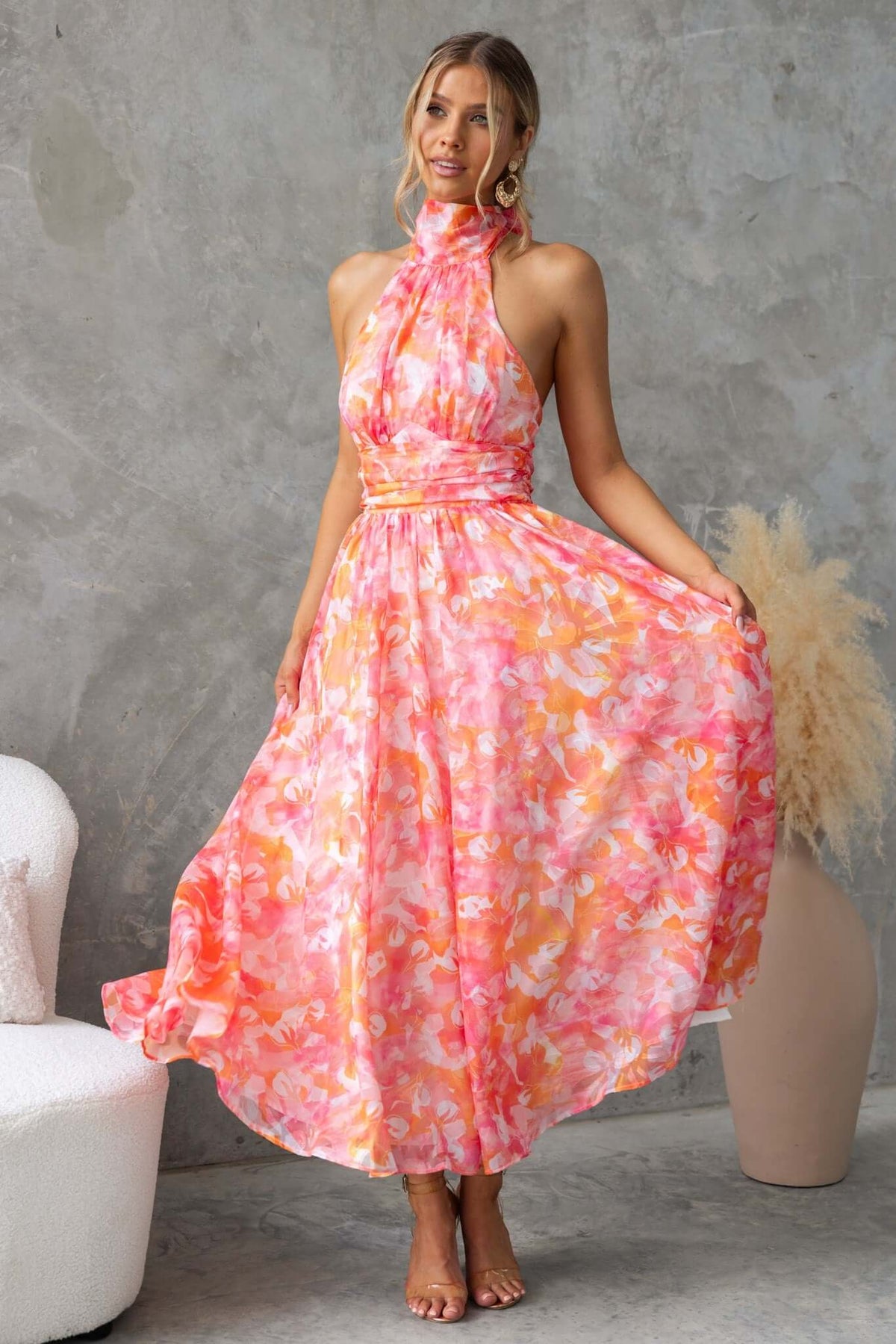 Little Things Maxi Dress in pink floral print, featuring a high tie neckline and flowing skirt, perfect for summer occasions.