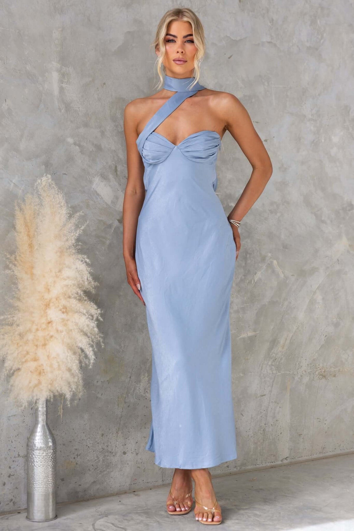 Lydie Maxi Dress in light blue, strapless with tie and side zip, featuring a sleek design and slight sheen.