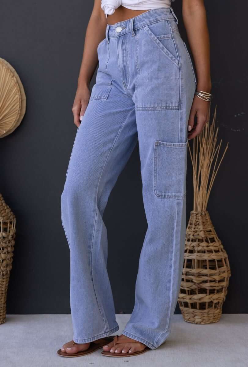 Cargo style Madrid jeans in light blue denim, featuring multiple pockets and a mid-high waist fit.