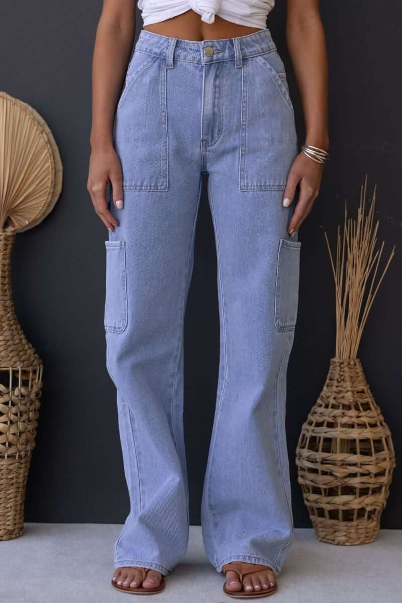 Cargo style Madrid Jeans in light blue, featuring pockets, mid-high waist fit, and a relaxed silhouette.