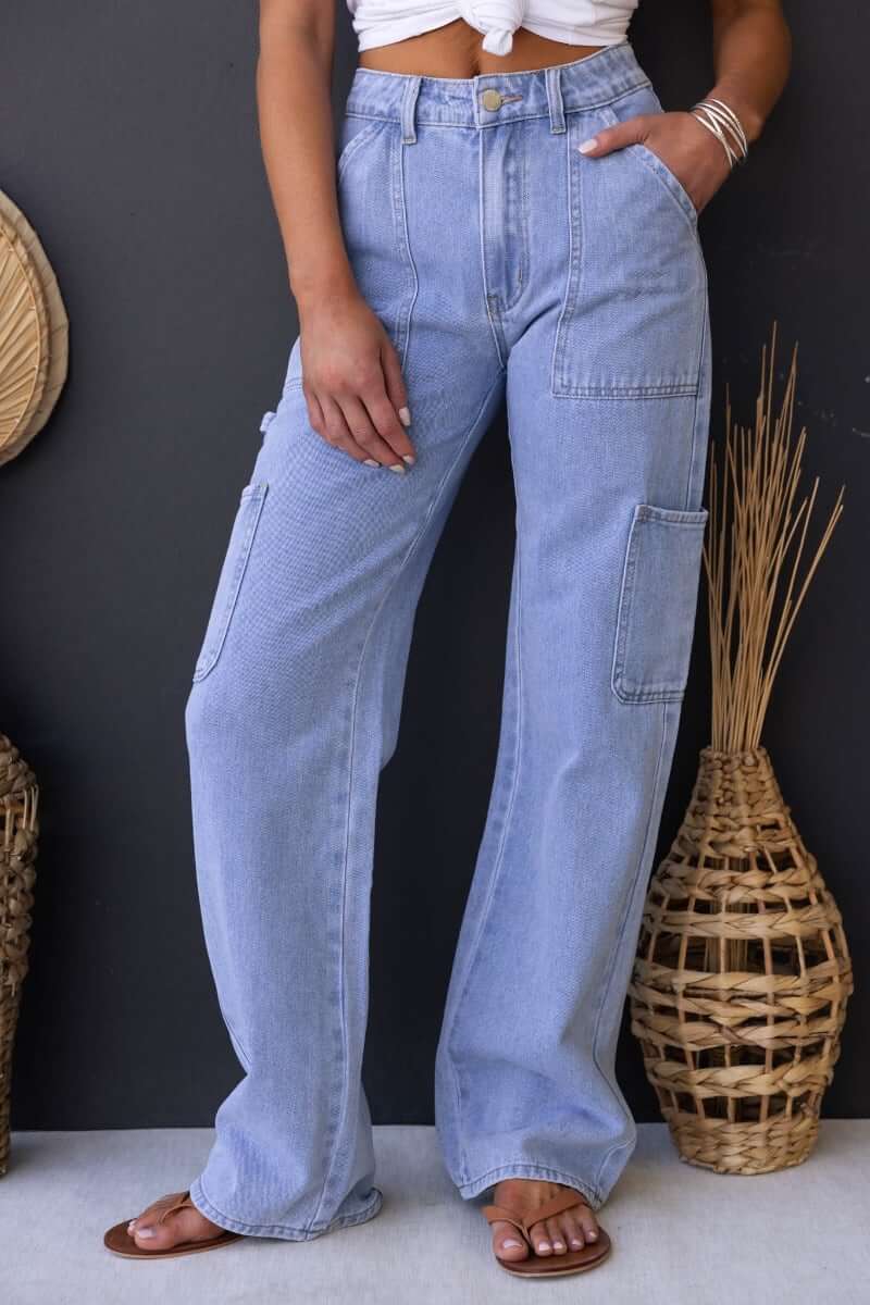 Cargo style Madrid jeans in light blue denim with pockets, featuring a mid-high waist fit and relaxed silhouette.
