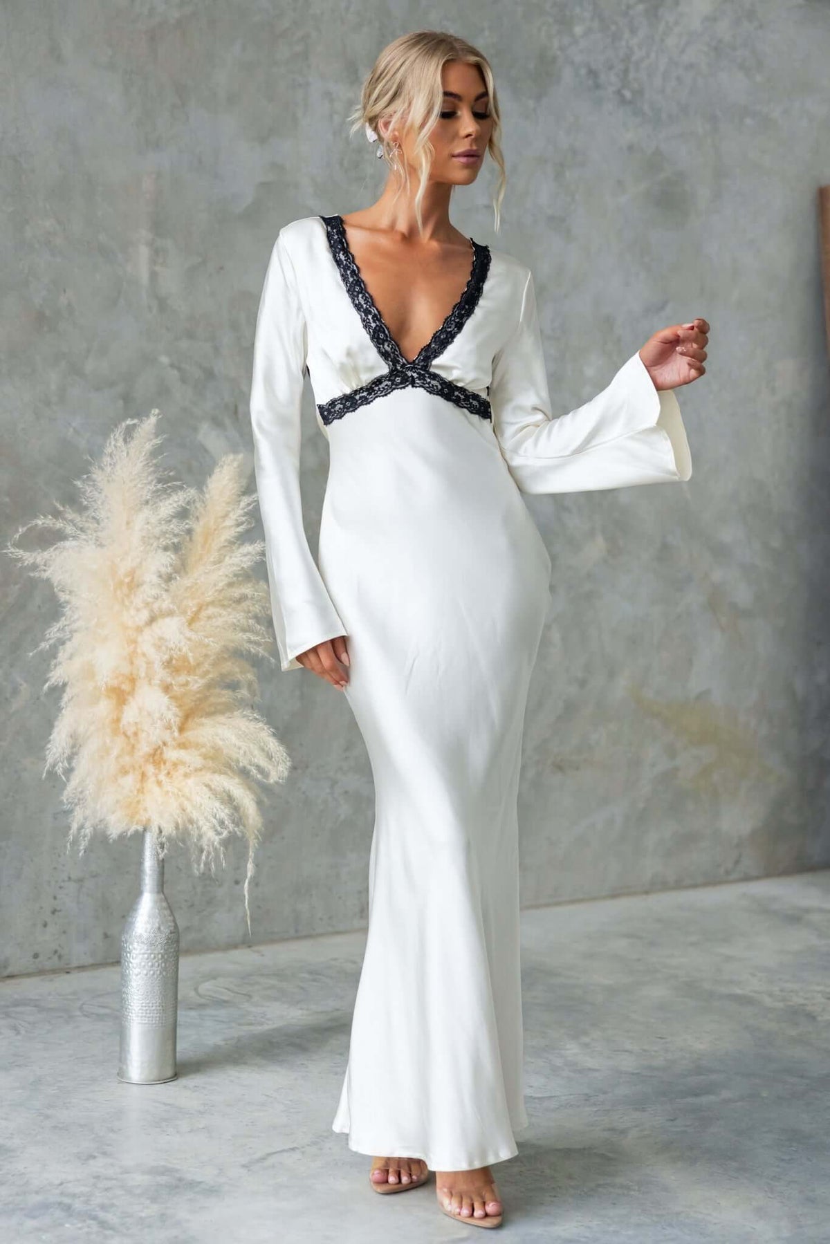 Elegant Nicholie Maxi Dress with lace detail, long sleeves, and draping material, perfect for bridal or special occasions.