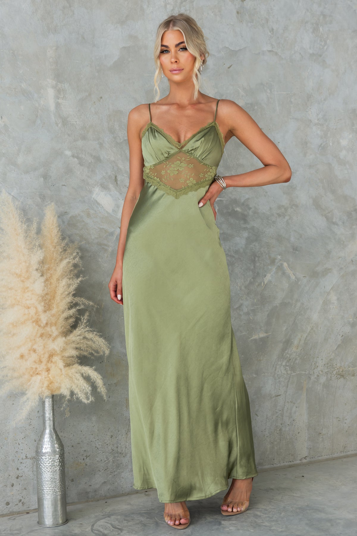 Elegant olive green maxi dress with adjustable straps and lace panel, perfect for summer occasions.