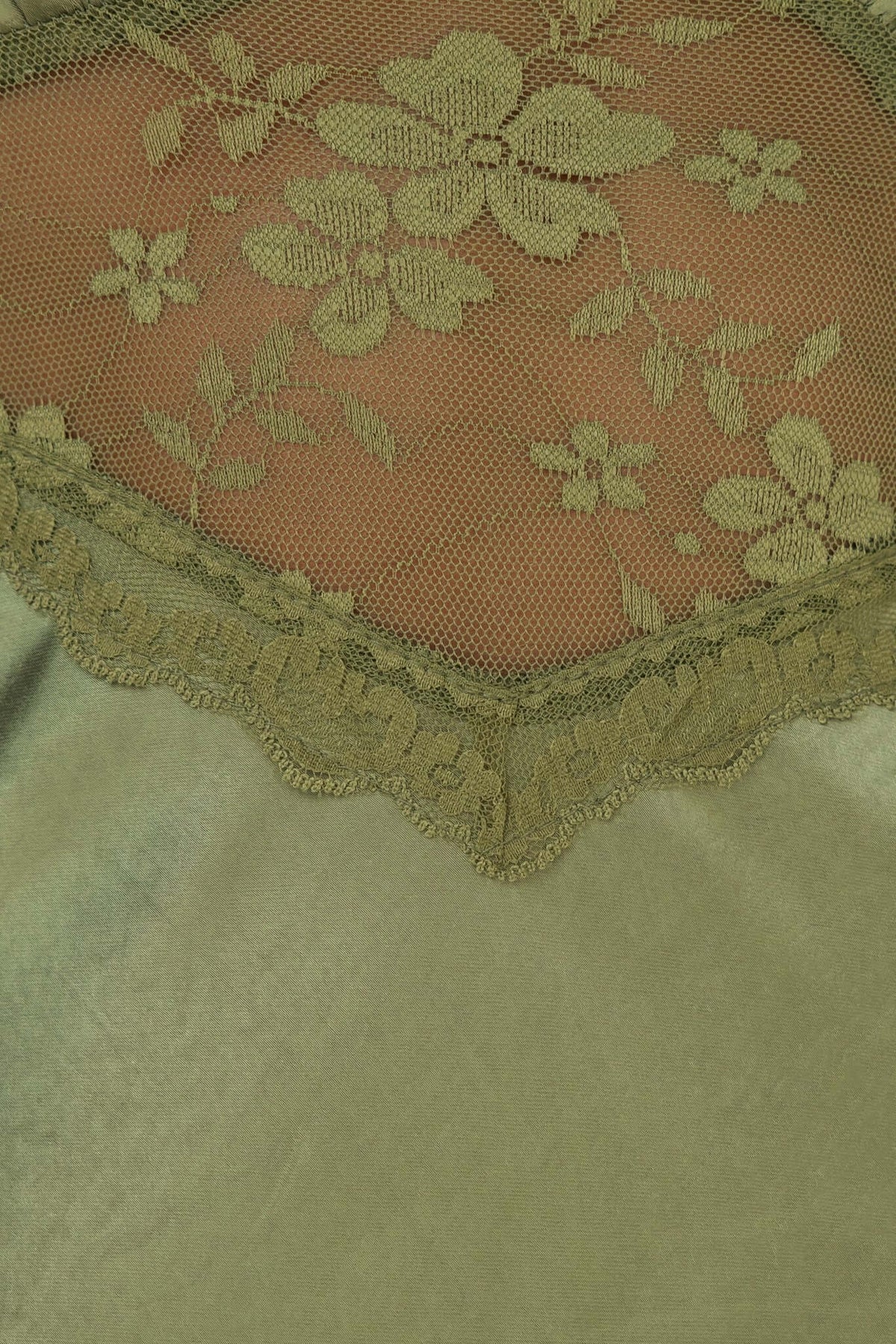 Close-up of lace panel detailing on an Obsidian Maxi Dress, showcasing floral design and elegant finish.