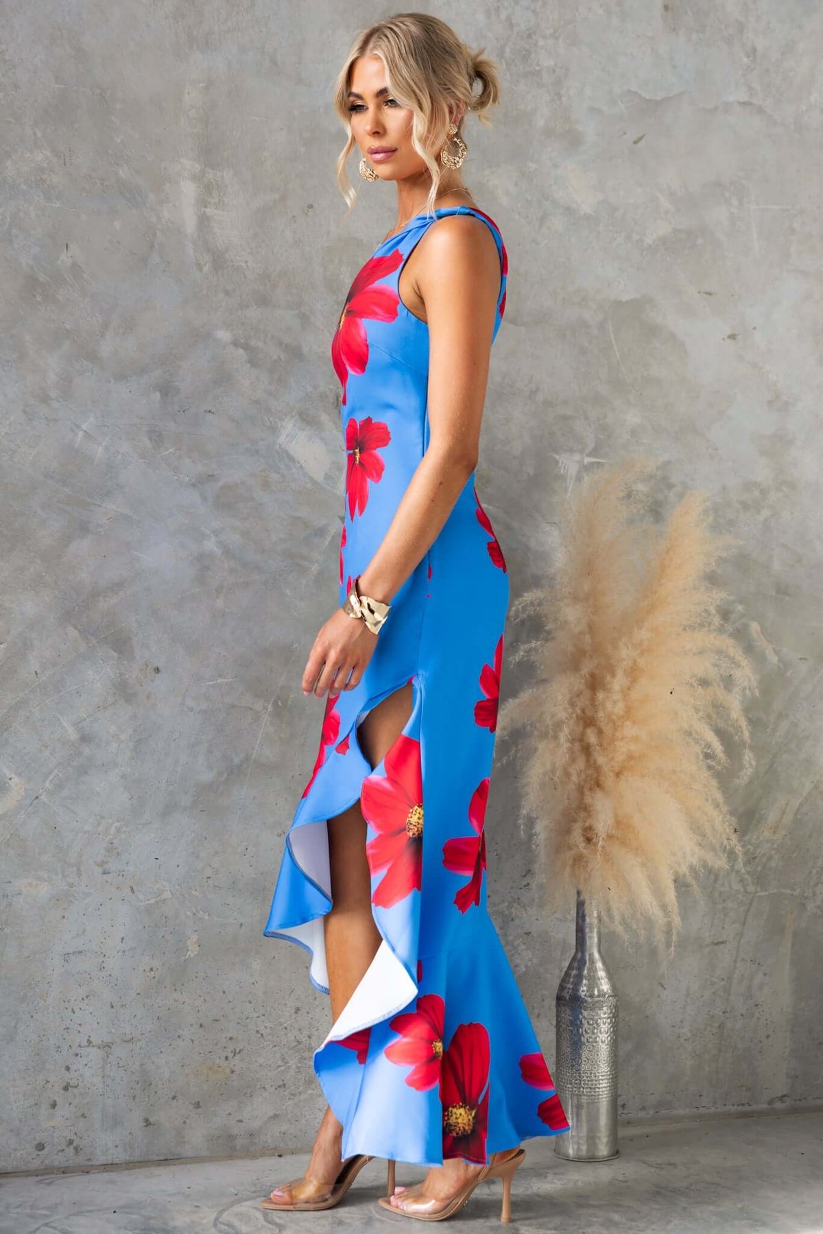Qonway maxi dress featuring a one-shoulder neckline, asymmetric hem, and vibrant floral print, model styled elegantly.