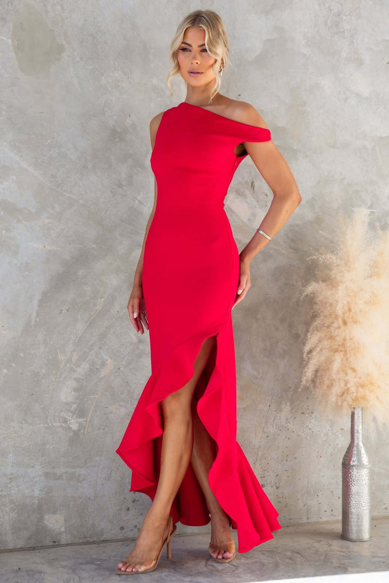 Raleigh Maxi Dress in red with asymmetric neckline and hem, featuring a side slit and elegant silhouette.