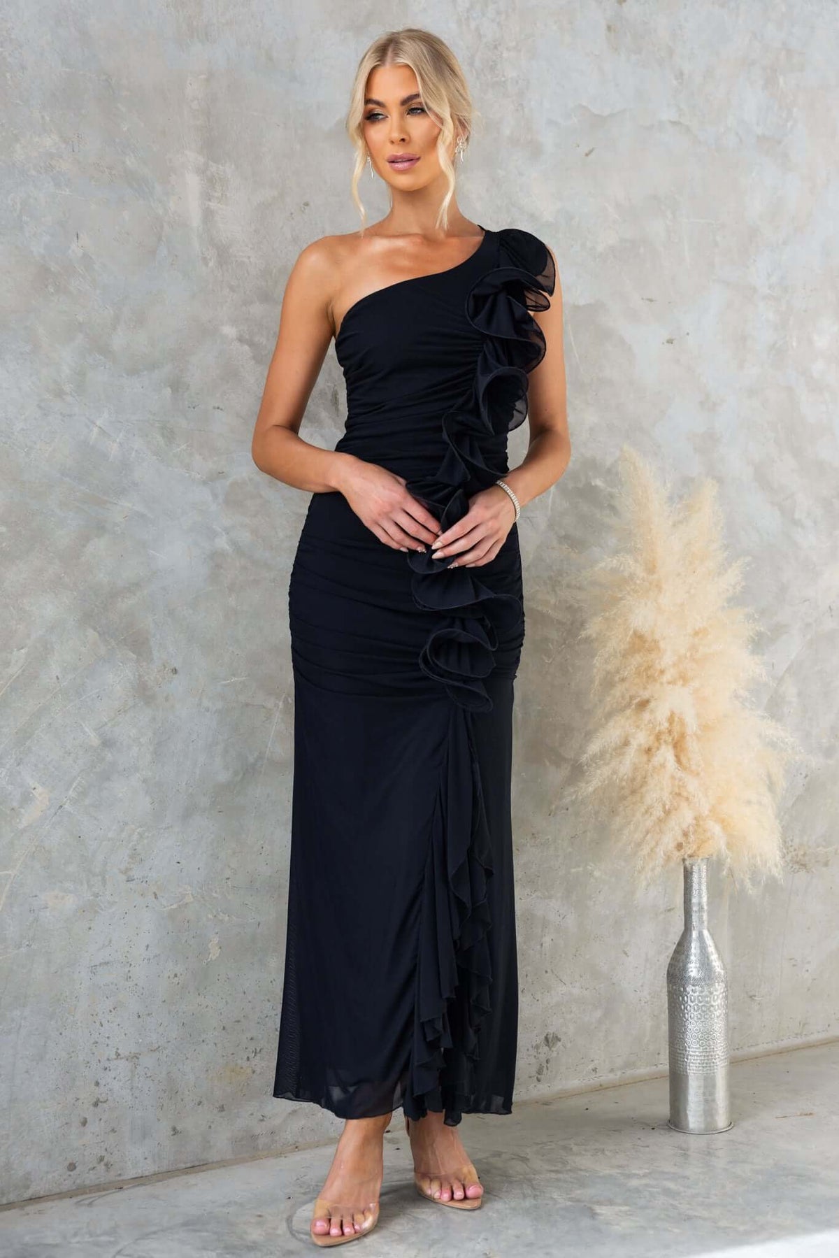Rehna Maxi Dress by Amaroso Bridal, featuring one-shoulder neckline and ruffle detail, perfect for elegant occasions.