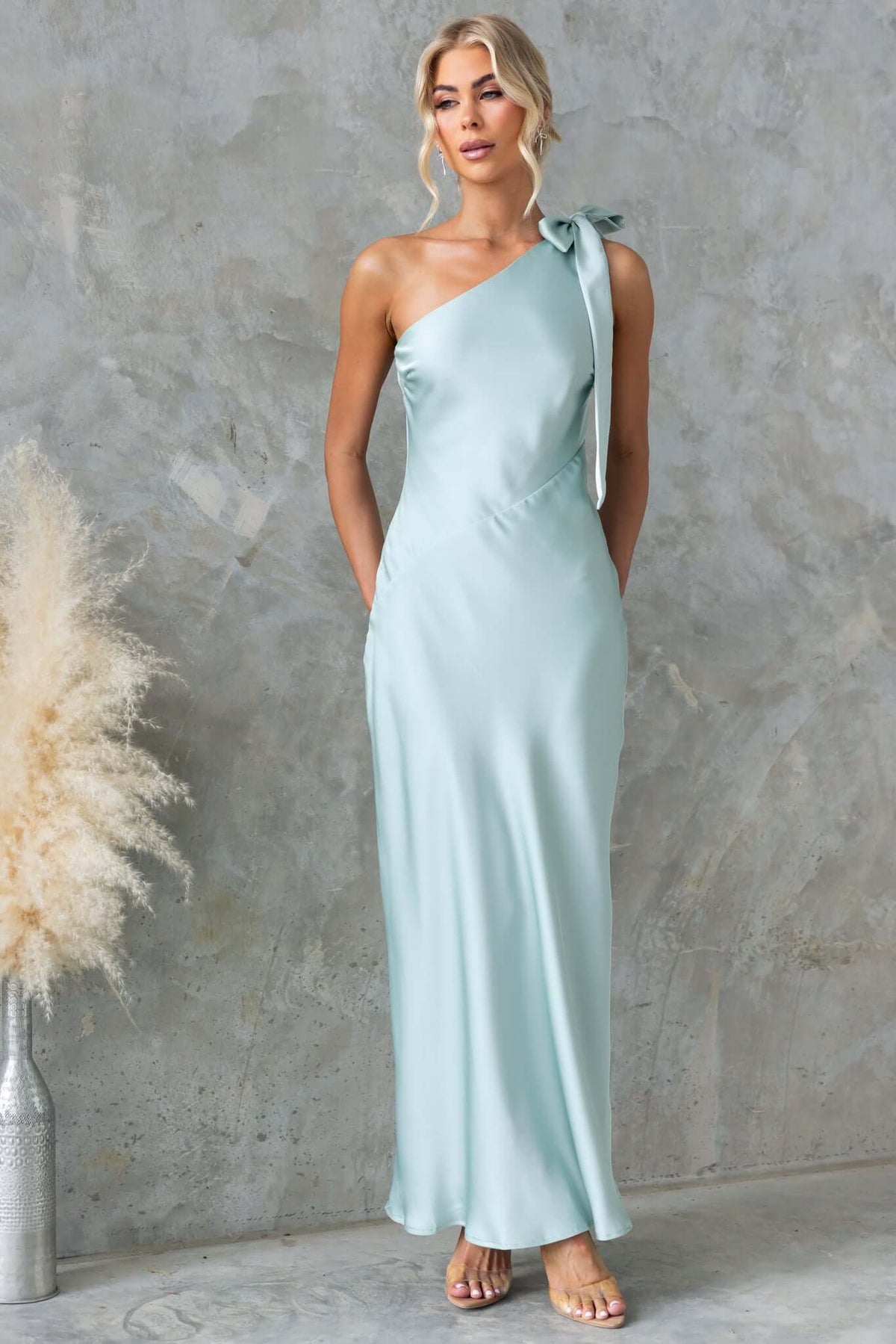 Ronnie Maxi Dress in soft mint satin with one-shoulder tie neckline, perfect for elegant occasions.