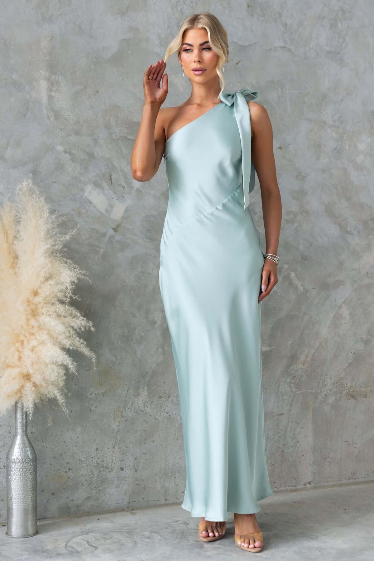 Ronnie Maxi Dress in satin with one-shoulder tie neckline and side zip, perfect for elegant occasions.