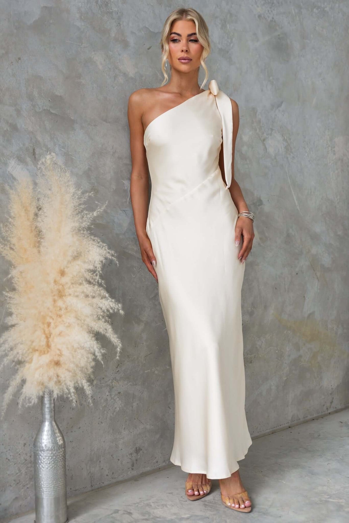 Elegant Ronnie Maxi Dress featuring a one-shoulder tie neckline, crafted in satin material, perfect for bridal occasions.