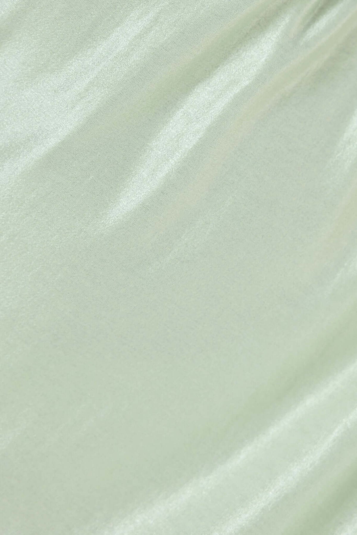 Close-up of Sancia Maxi Dress fabric showing slight sheen and soft texture in light green.