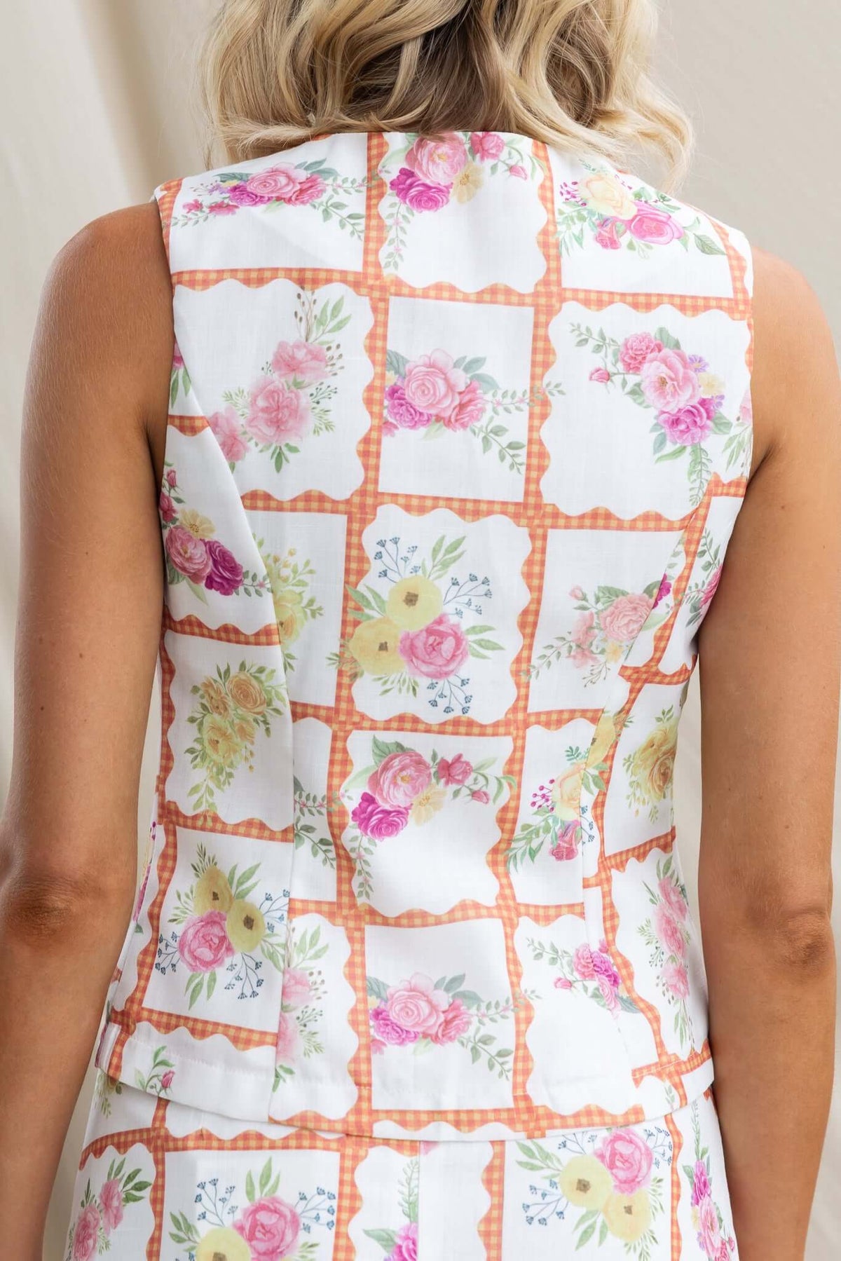 Back view of the Shawnee Top featuring a floral print with a V-neckline and tie detail, perfect for a relaxed fit.