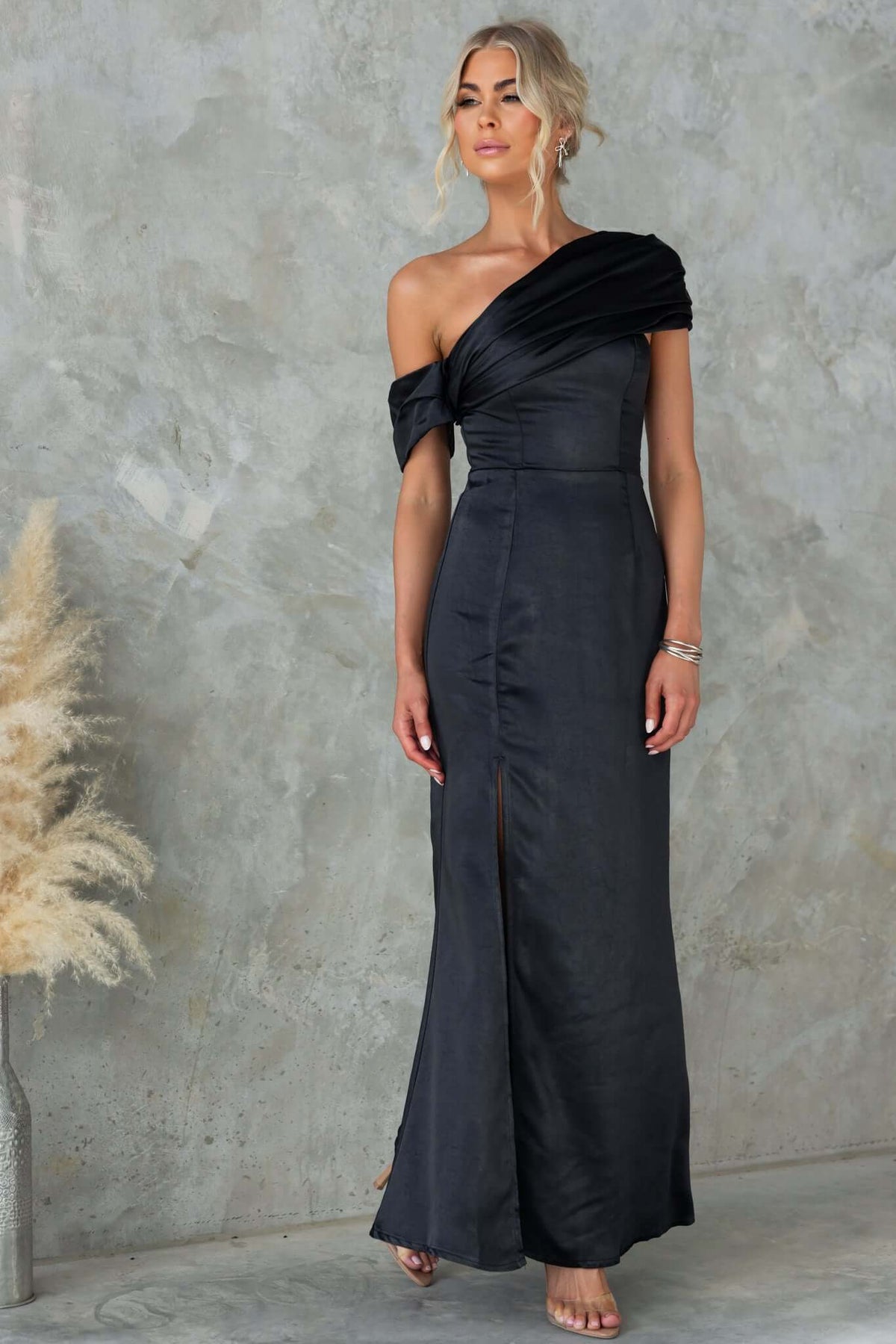 Amaroso Bridal Sonnet Maxi Dress in satin with asymmetrical neckline and side split, model wears size 6/XS.