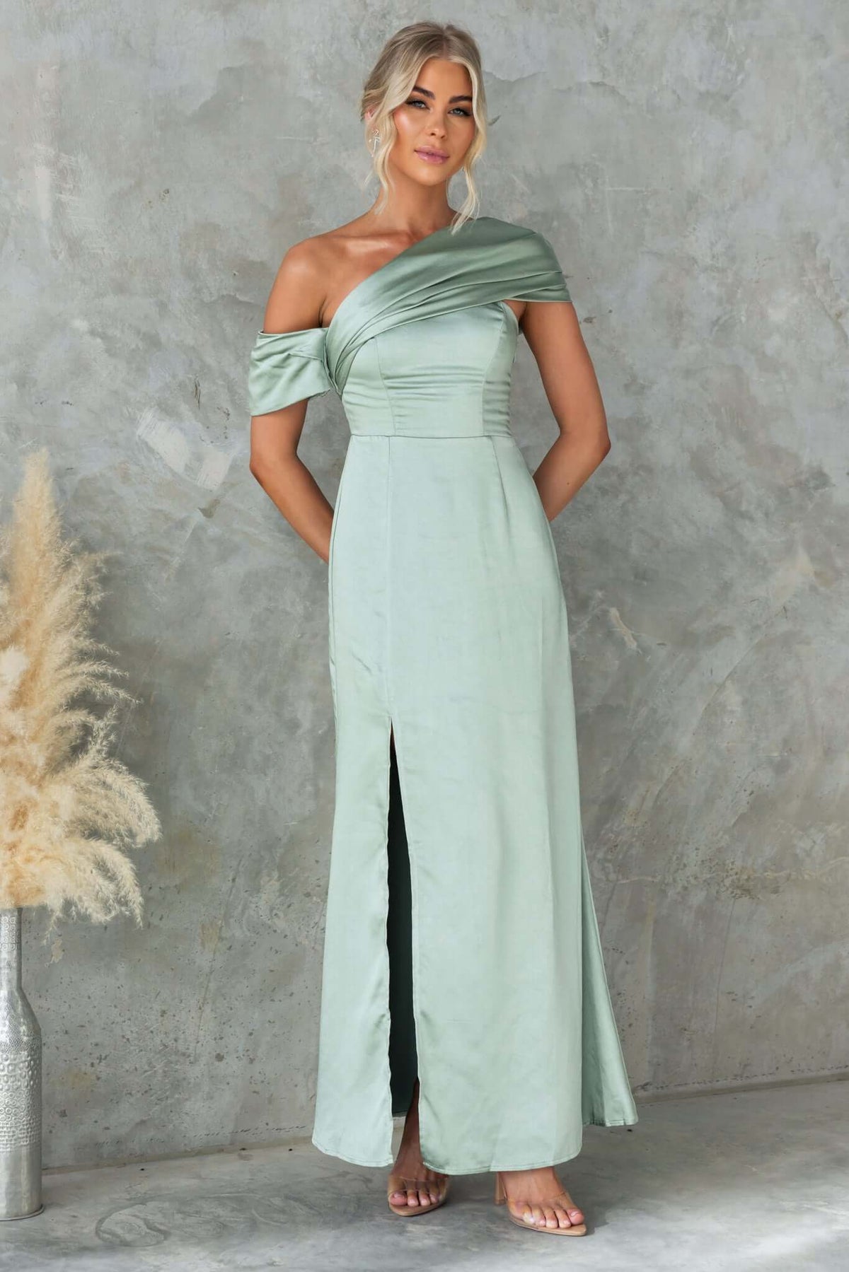 Elegant Sonnet Maxi Dress in soft green satin with asymmetric neckline and side split, perfect for formal occasions.