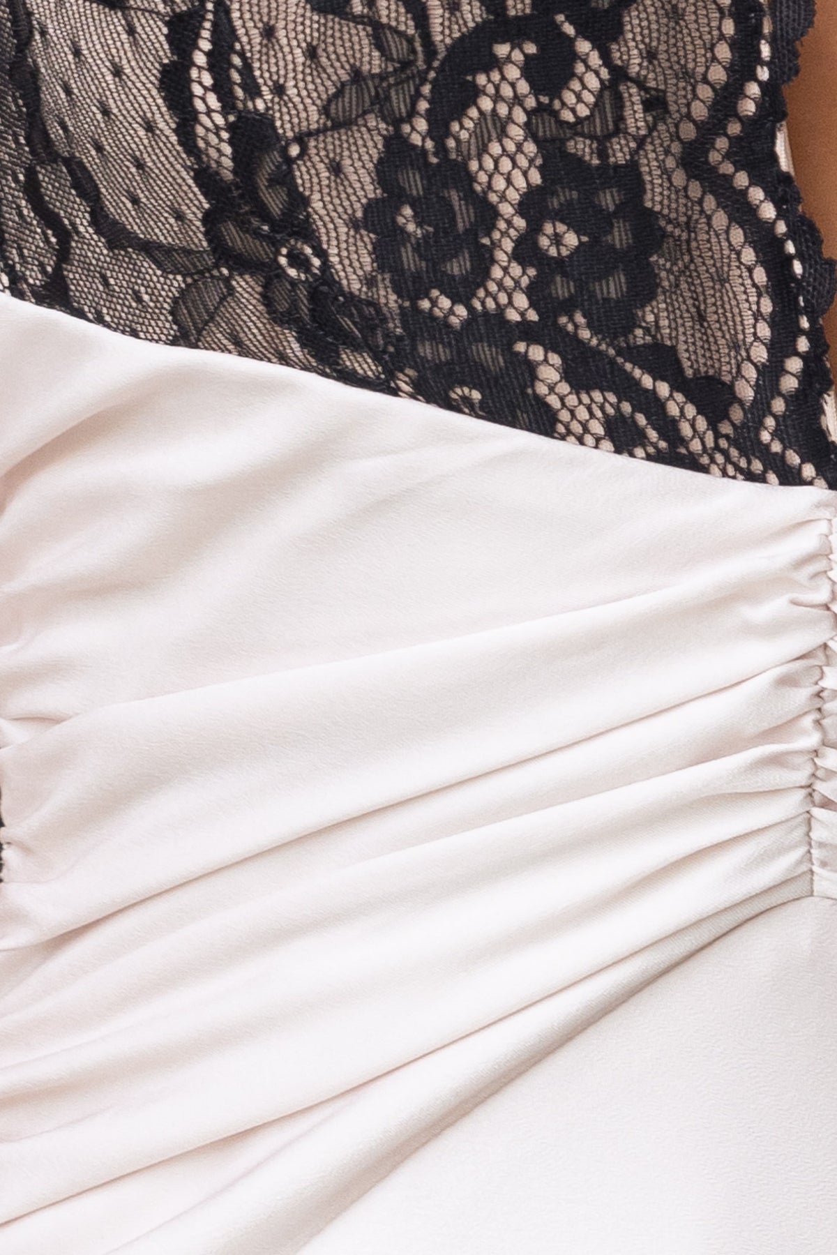 Close-up of Sonrisa Maxi Dress showing lace bust and satin fabric detailing with ruching.