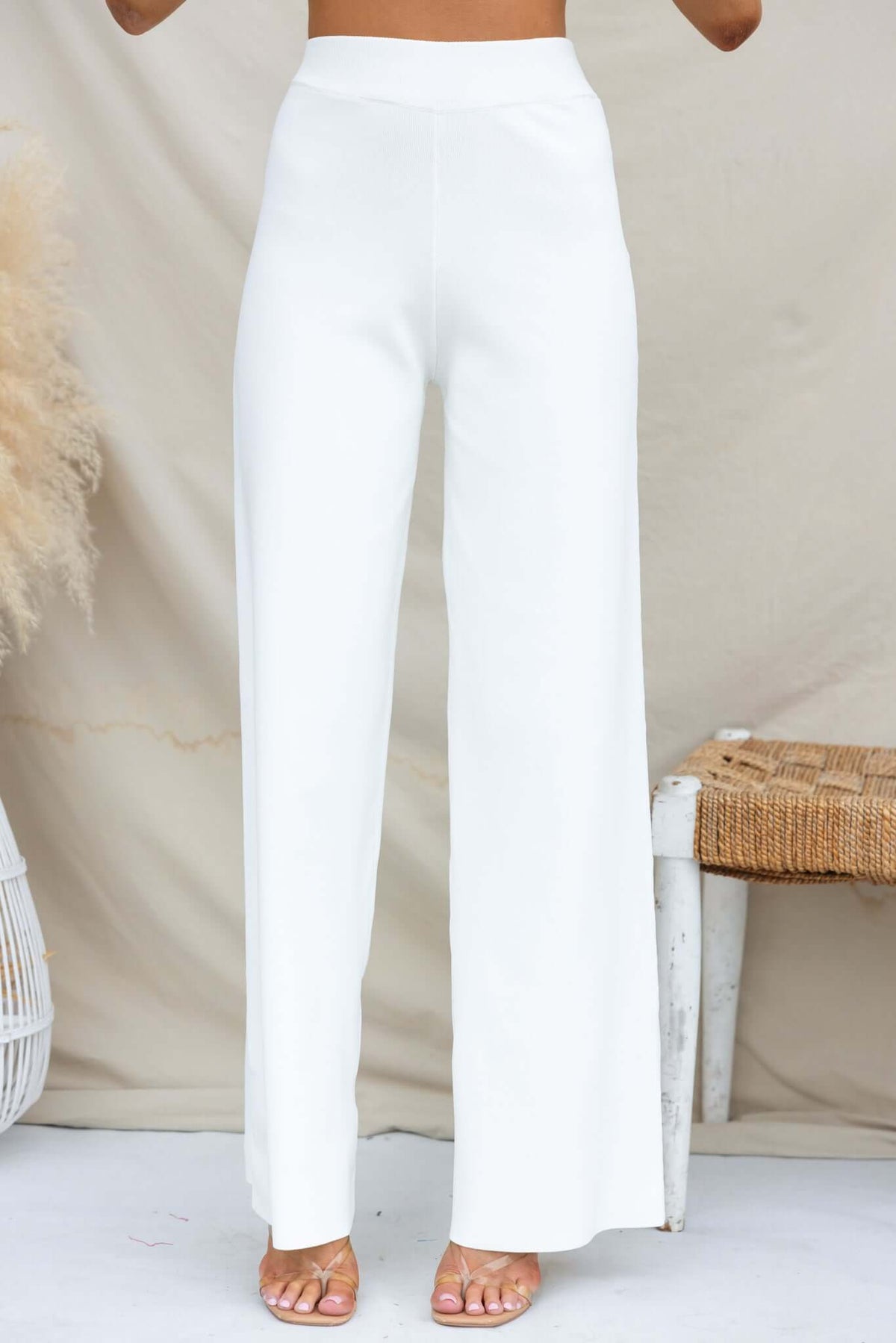 Tammie Pants, mid-high waist white knit pants with elastic waistband, featuring a standard fit and stretchy material.