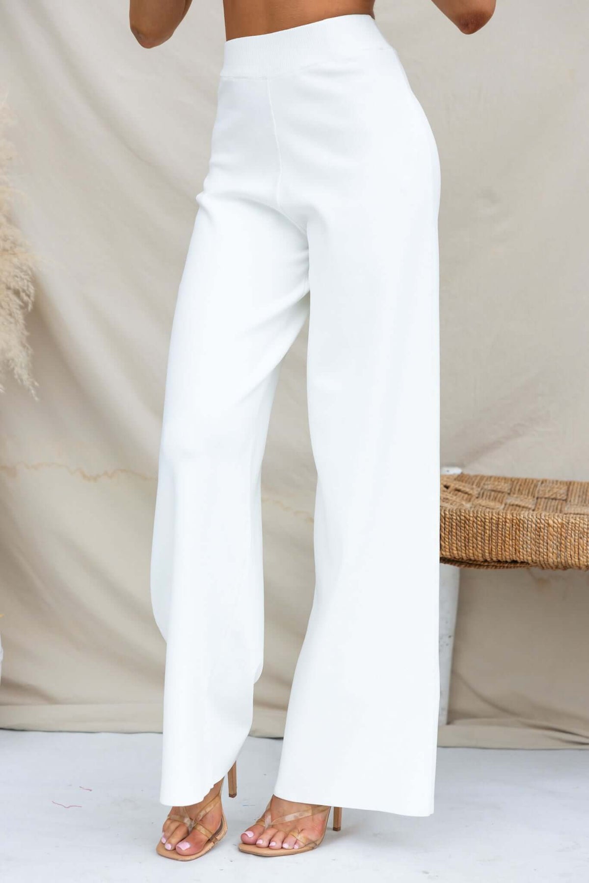 Tammie Pants in white, mid-high waist fit with elastic waistband, made from stretchy knit material, perfect for casual wear.