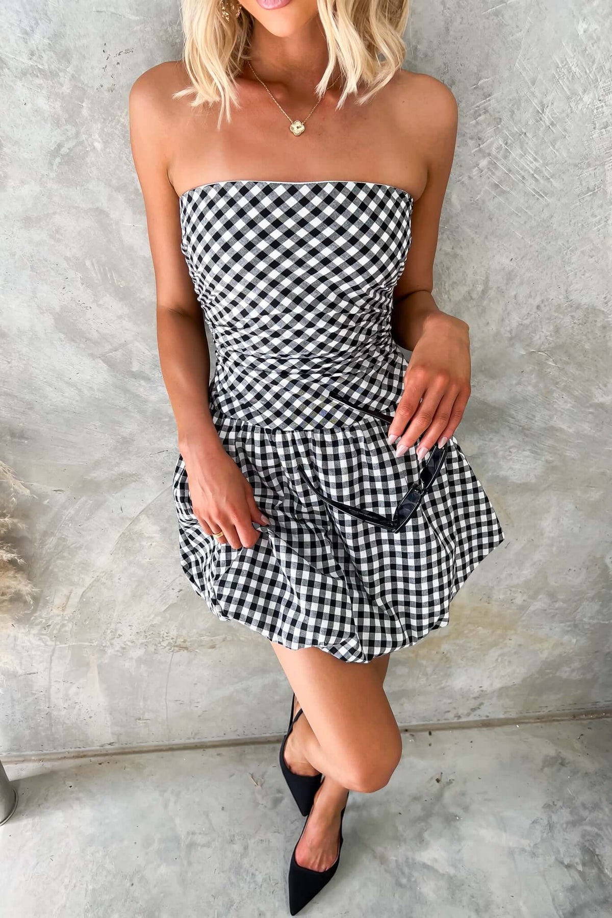Toni Dress: Strapless gingham dress with bubble hem, invisible zip, and anti-slip detail, perfect for summer style.