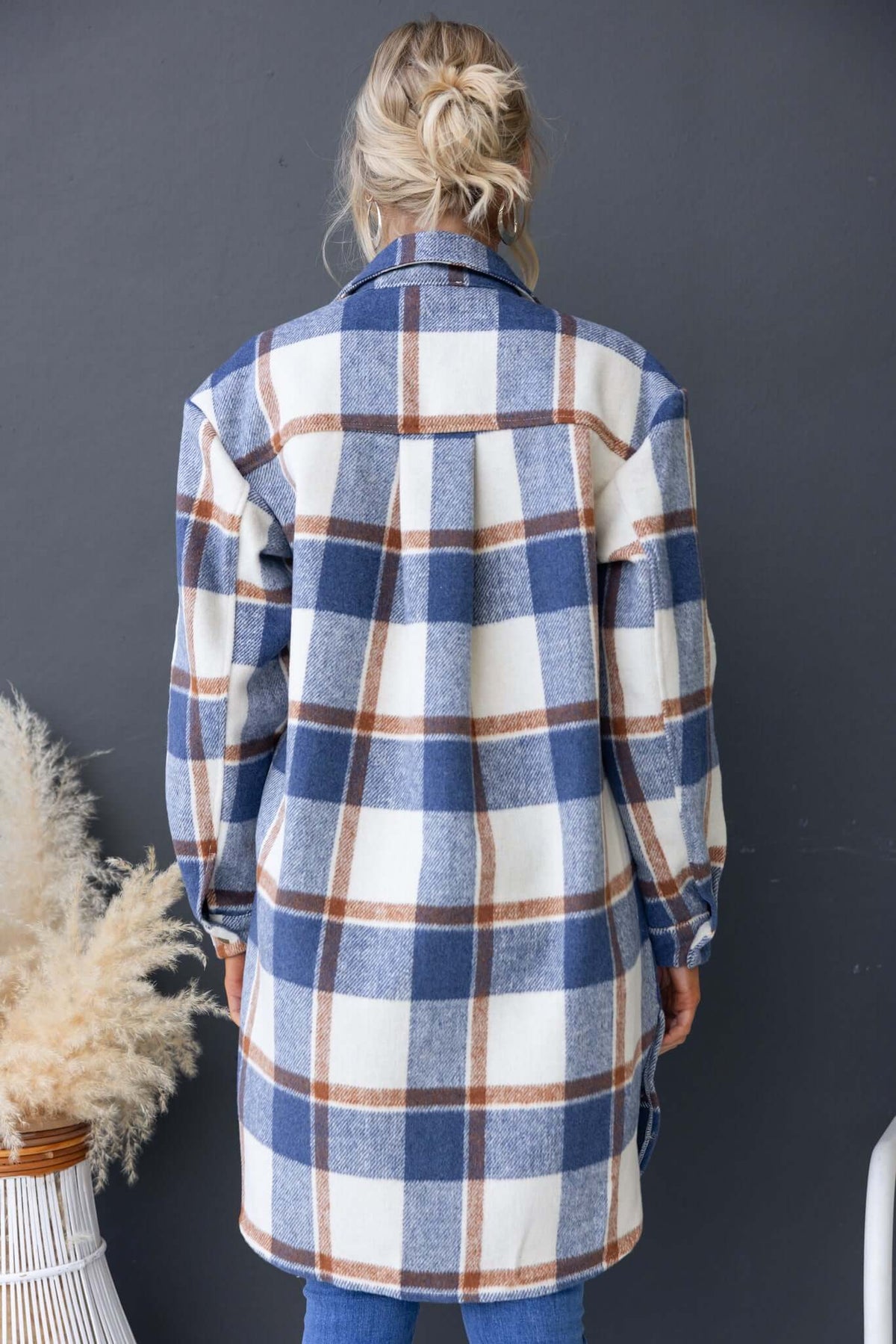 Back view of the Torres Shacket featuring a blue and white plaid pattern, collar, and relaxed fit.