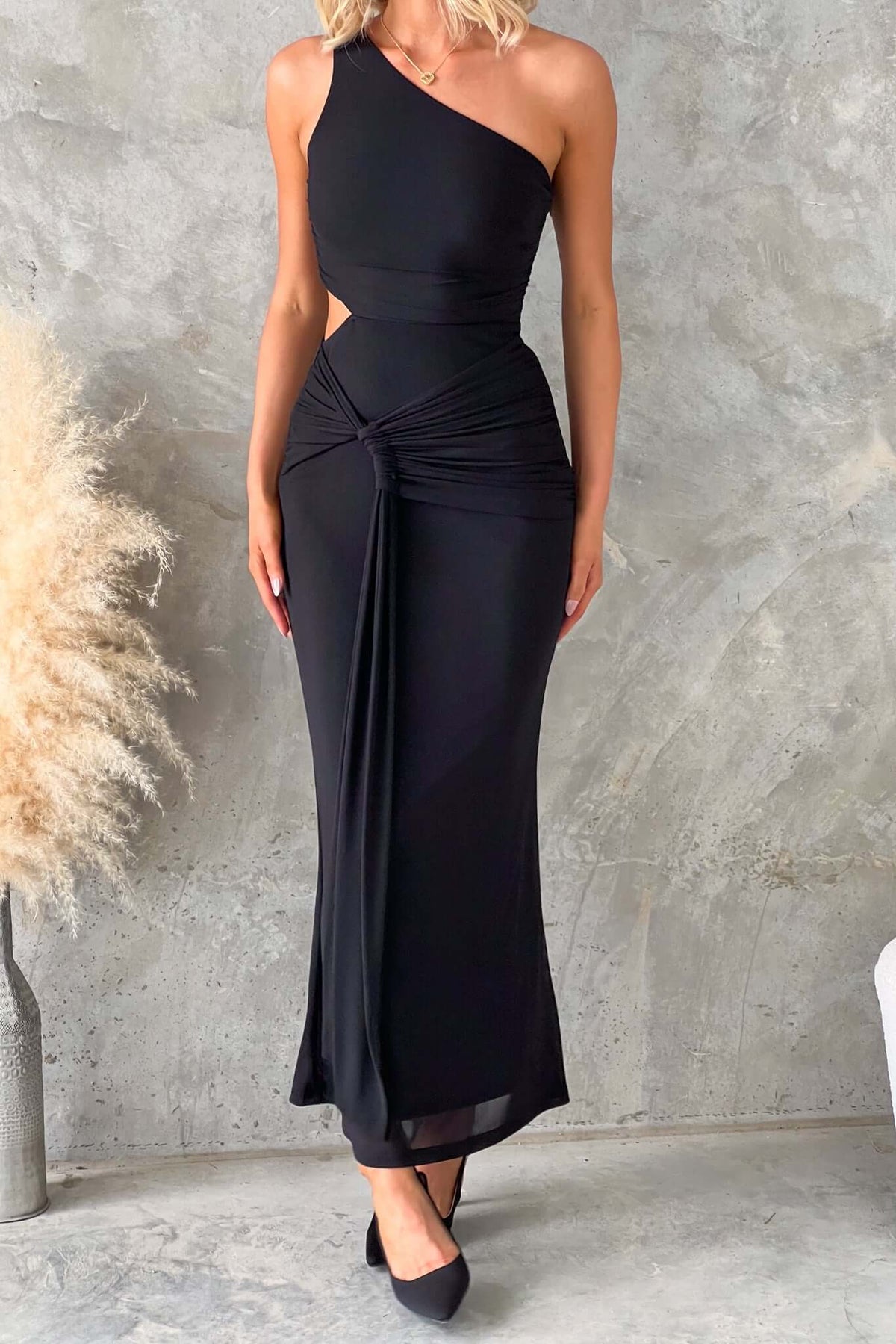 Ultra maxi dress with a one-shoulder neckline, cut-out at waist, and stretch mesh material, perfect for special occasions.
