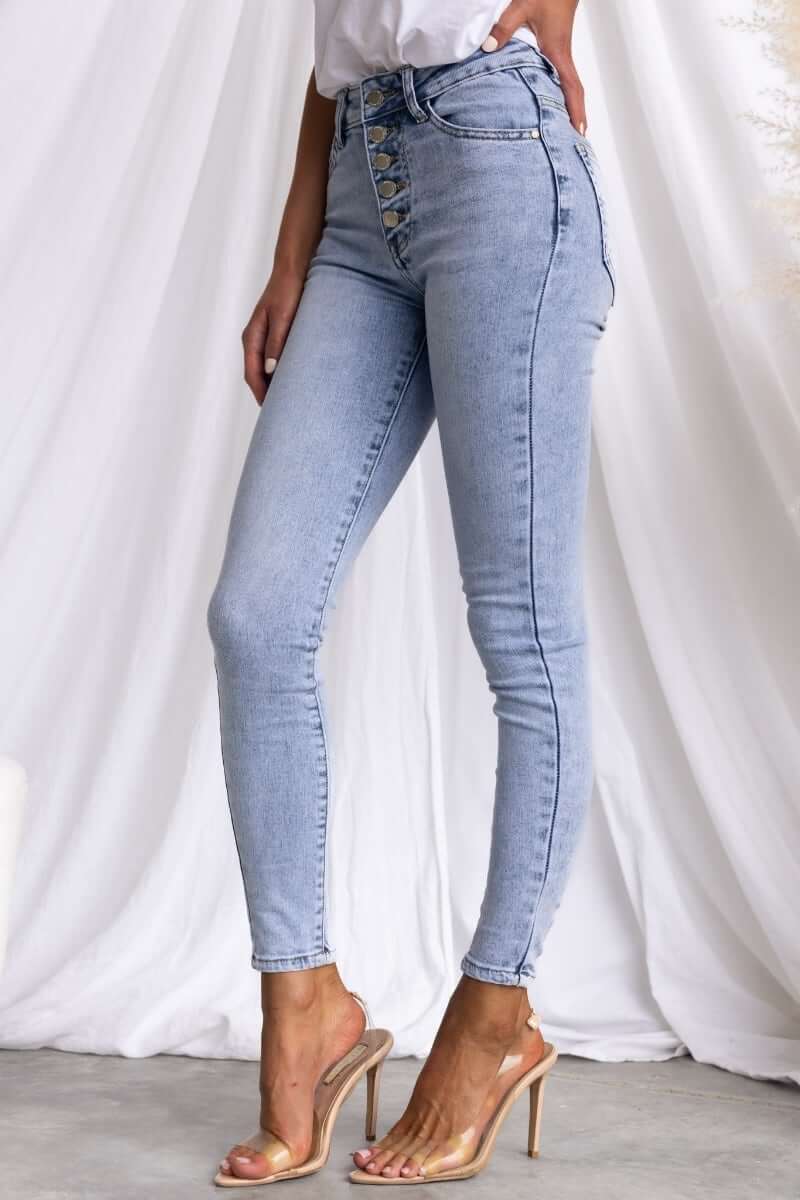 Skinny fit Under Cover Jeans with button-up front, mid-high waist, and pockets, modeled in light blue denim.
