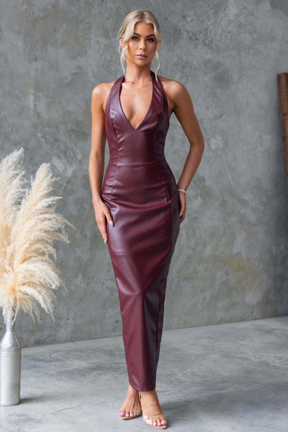 Veridan Maxi Dress in faux leather with halter neckline and back split, model wearing size XS.