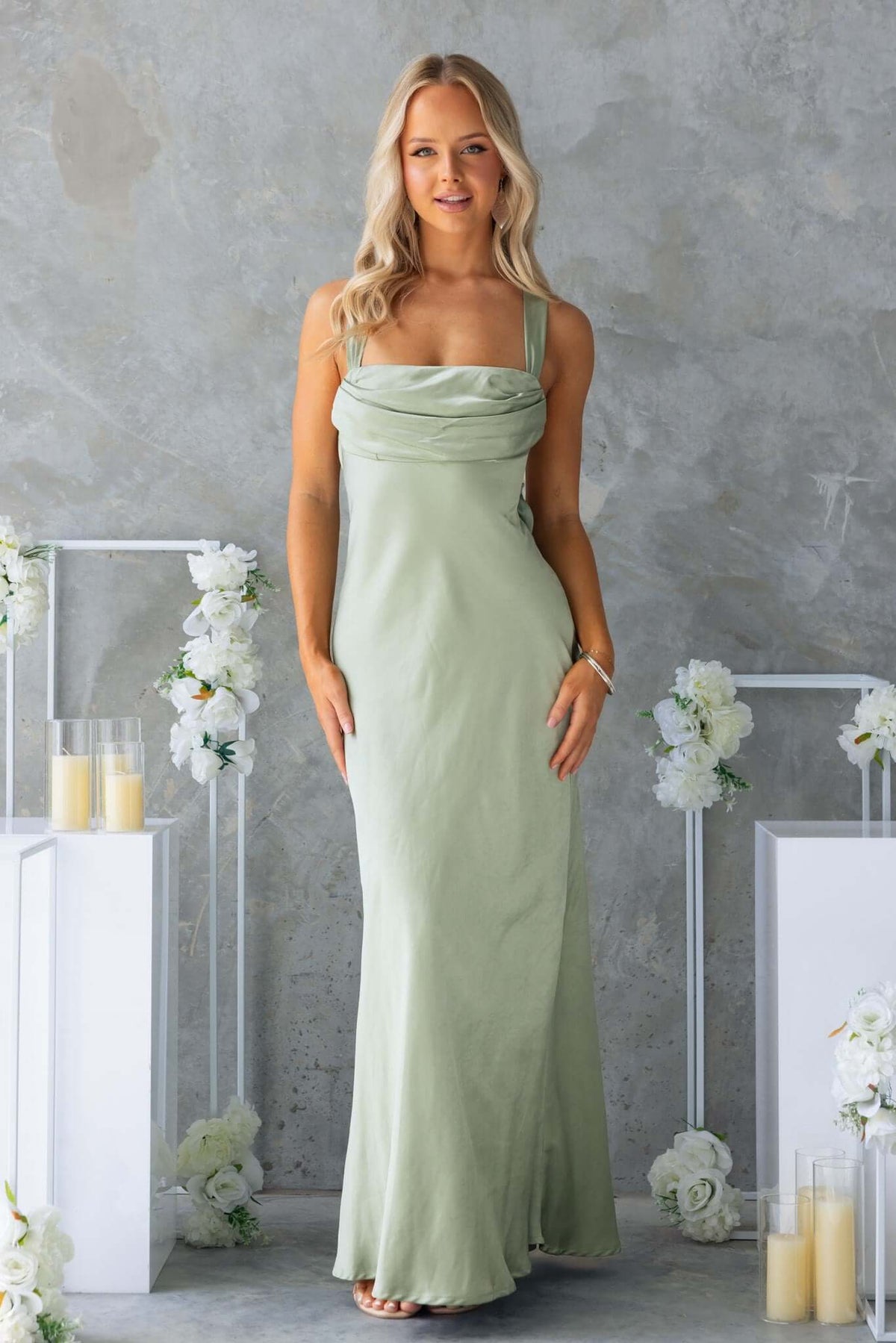 Megan Maxi Dress in soft green, featuring adjustable straps and a sleek silhouette, perfect for special occasions.