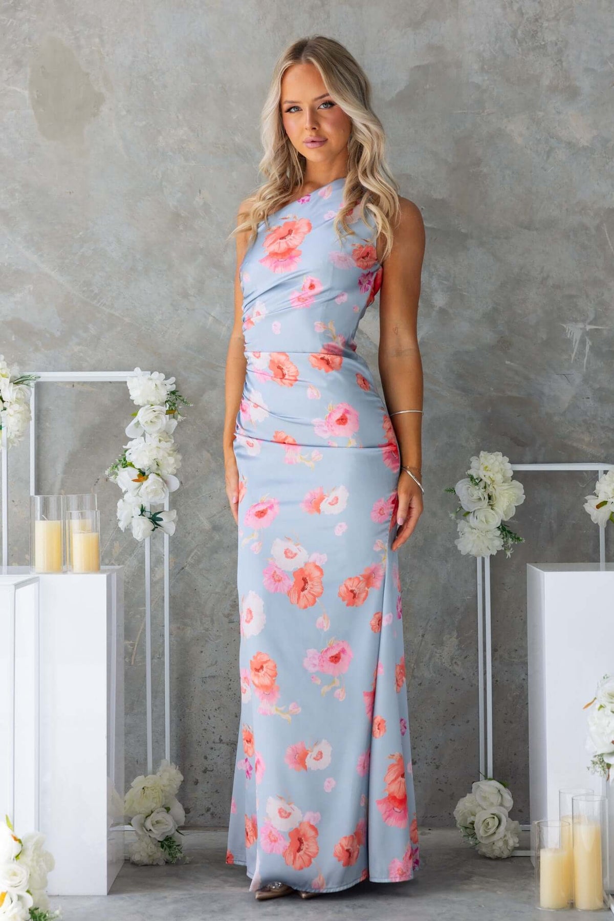 Jadeite maxi dress featuring a floral print, satin feel, one-shoulder neckline, and side zip closure.