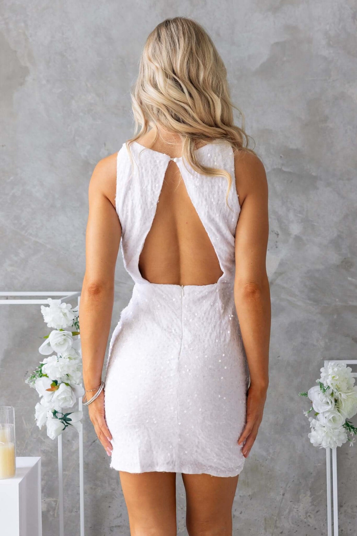 Back view of Nerissa Dress featuring a high neckline and open back design with sequins.