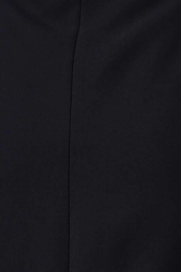 Close-up of the textured fabric of the Jayne Skirt in black, showcasing the sleek design and quality material.