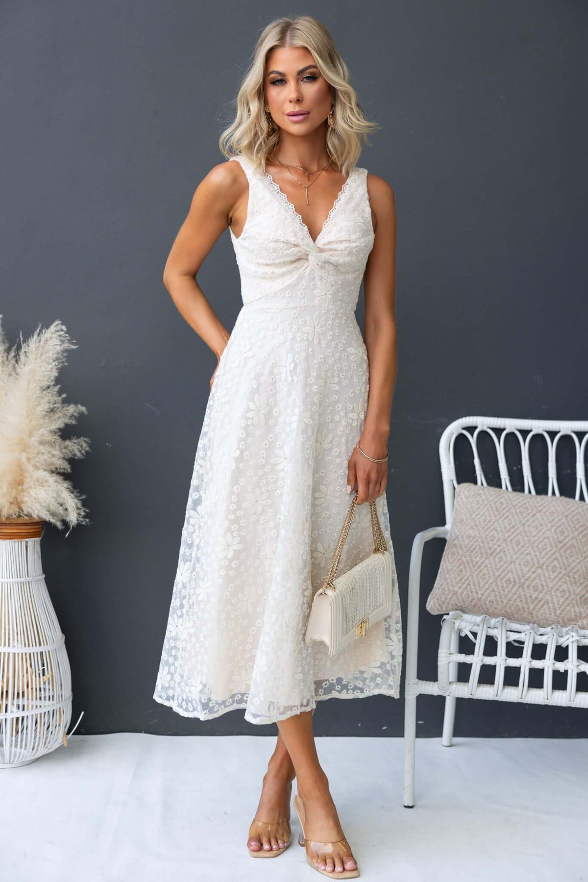 Elegant Yakima Midi Dress with twist bust detail, perfect for stylish occasions, made from 100% polyester.