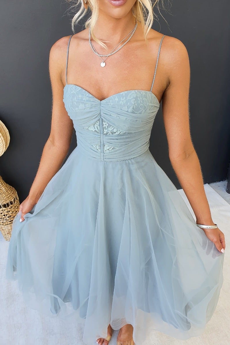 Genevie Midi Dress in light blue, featuring adjustable straps and tulle skirt, perfect for special occasions.