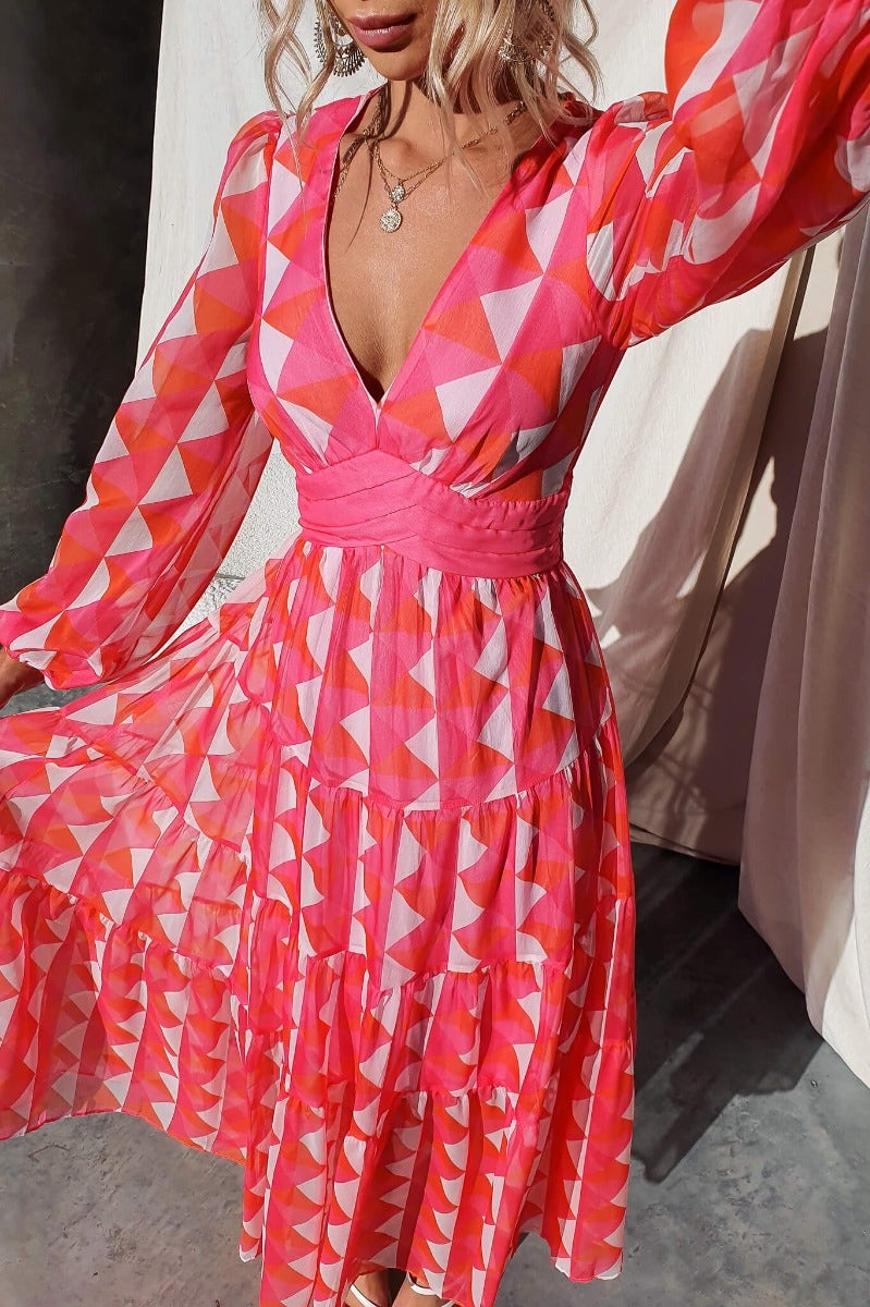 Cotta maxi dress featuring a V-neckline, elastic cuffs, and multi-color geometric pattern, ideal for stylish summer outfits.