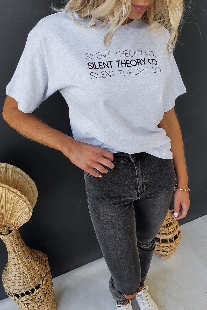 Ronan Tee by Silent Theory Co, round neck print tee worn by model in relaxed fit, styled with high-waisted jeans.