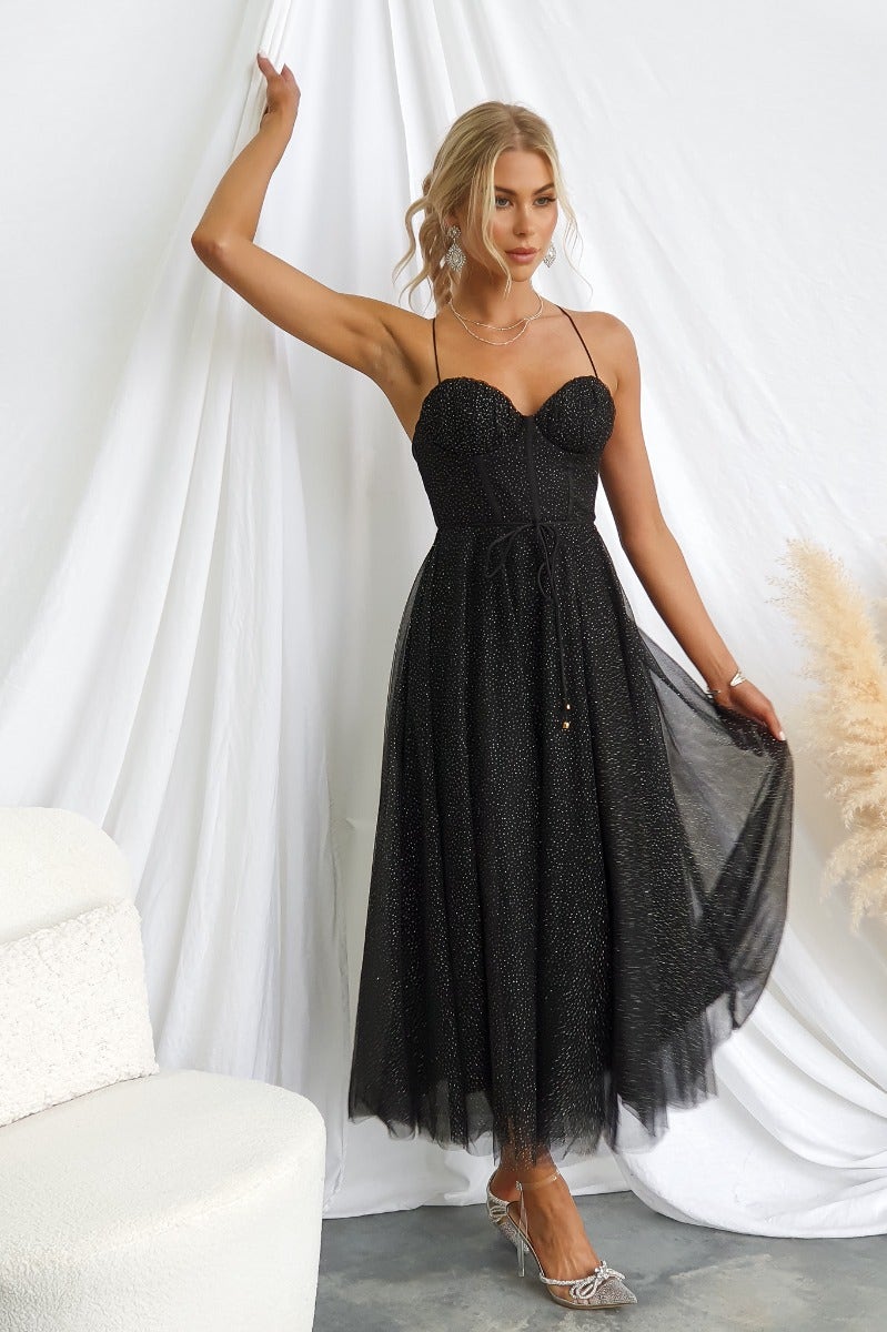 Black Tulle midi dress with adjustable straps and removable belt, featuring a padded bust and glitter detail.