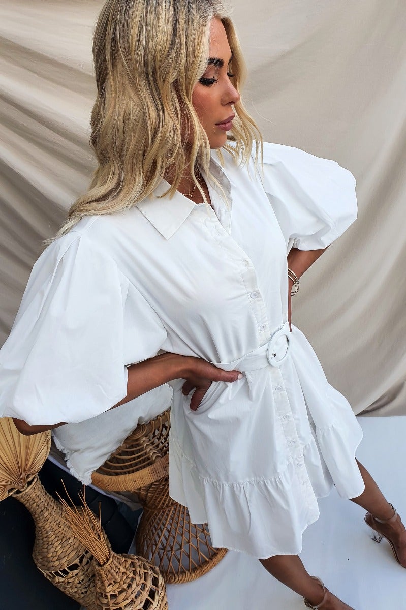 Eloisa Dress: White cotton button-up dress with a collar, elastic sleeve cuffs, and removable belt.