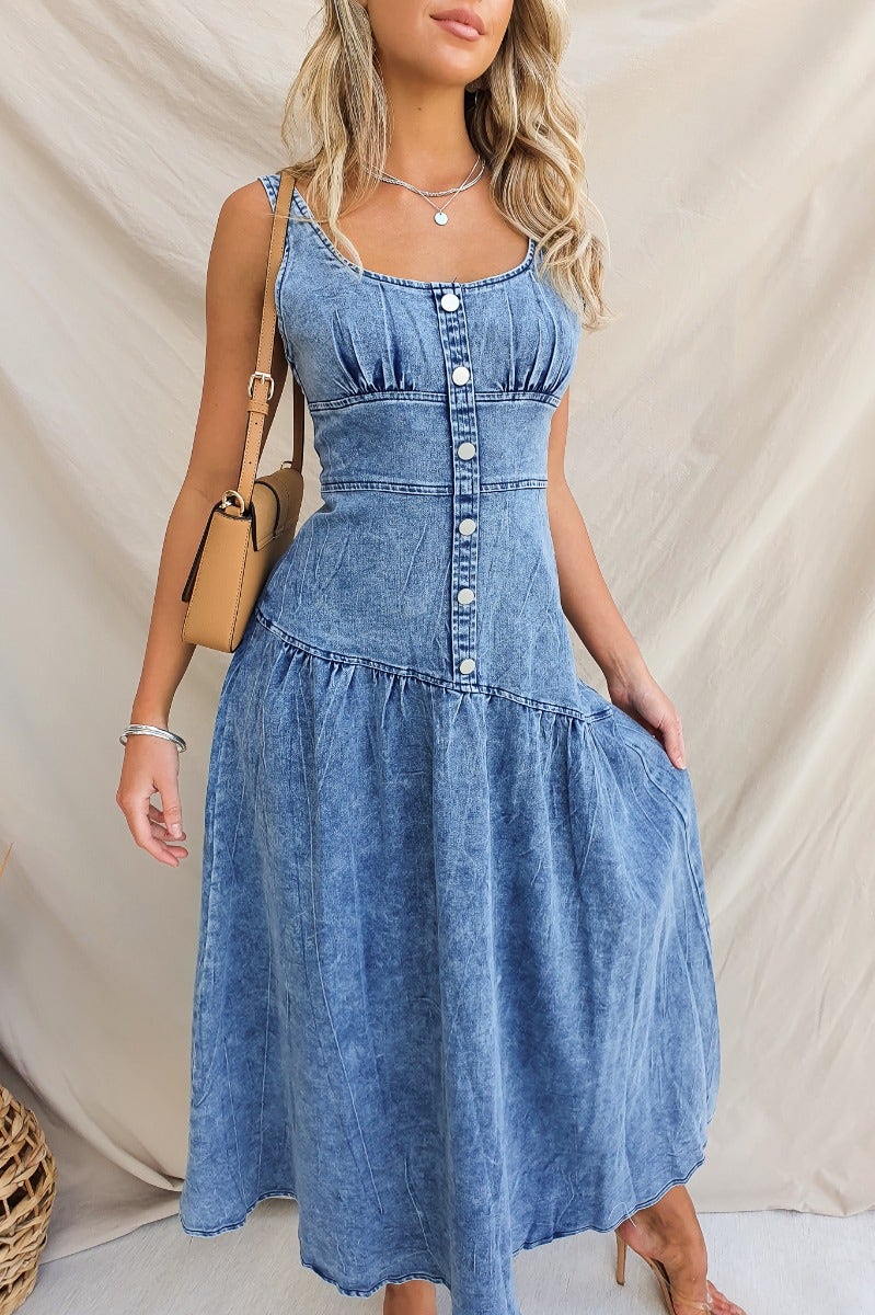 Reno Denim Midi Dress featuring a fitted bodice, non-functional buttons, and a flowing skirt, perfect for casual outings.