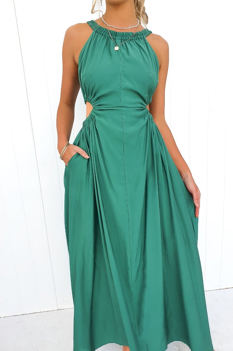 Silvena Maxi Dress in vibrant green, featuring a high neckline, cut-out waist, and pockets, perfect for summer events.