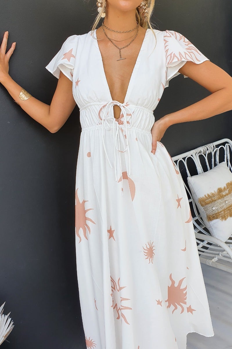 Milene Maxi Dress featuring a V-neckline, tie detail, and elastic waistband in cotton blend fabric.