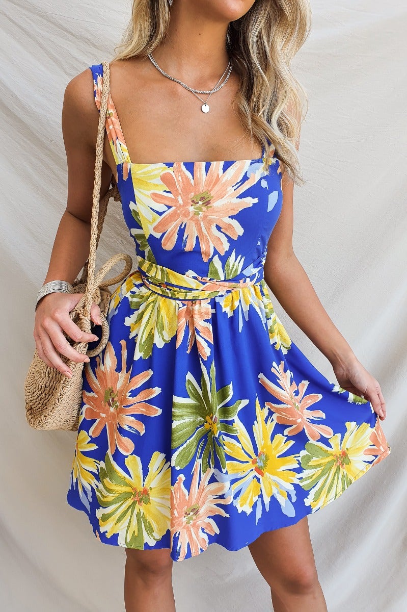 Haiti Dress: Floral print dress with adjustable straps, square neckline, and pockets, perfect for warm weather.