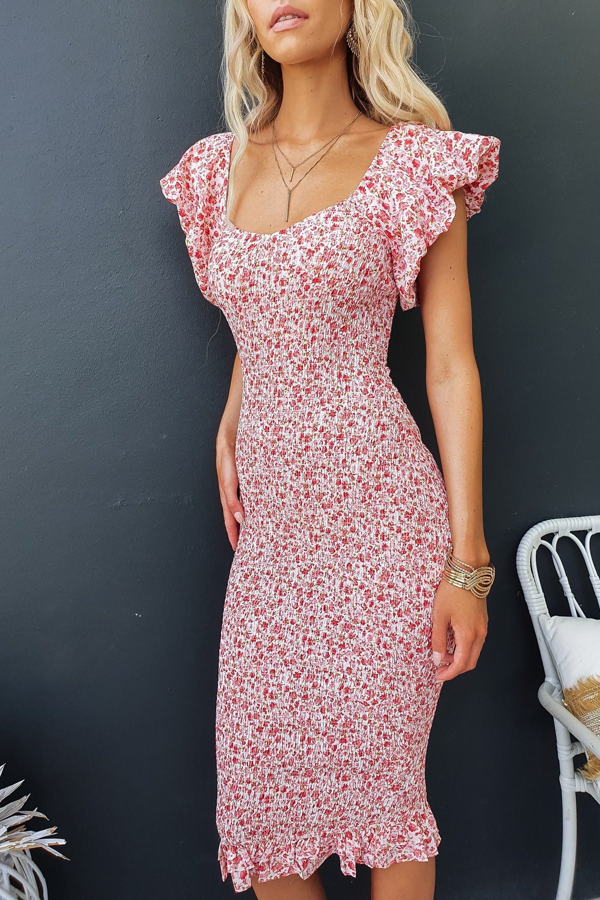 Floral print Akima midi dress with off-shoulder neckline and ruffled sleeves, perfect for spring and summer styles.