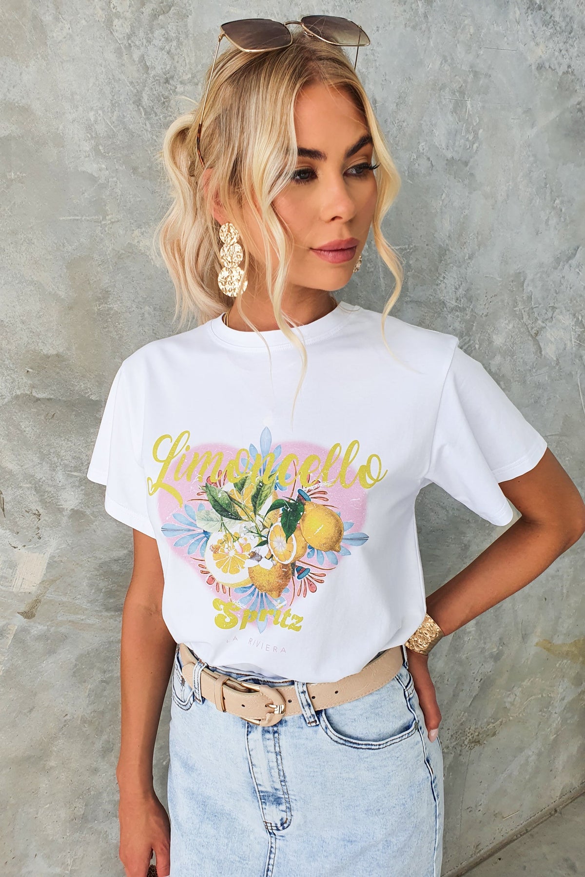 Model showcasing the Limocello Spritz print tee with a round neckline, styled with denim and accessories.