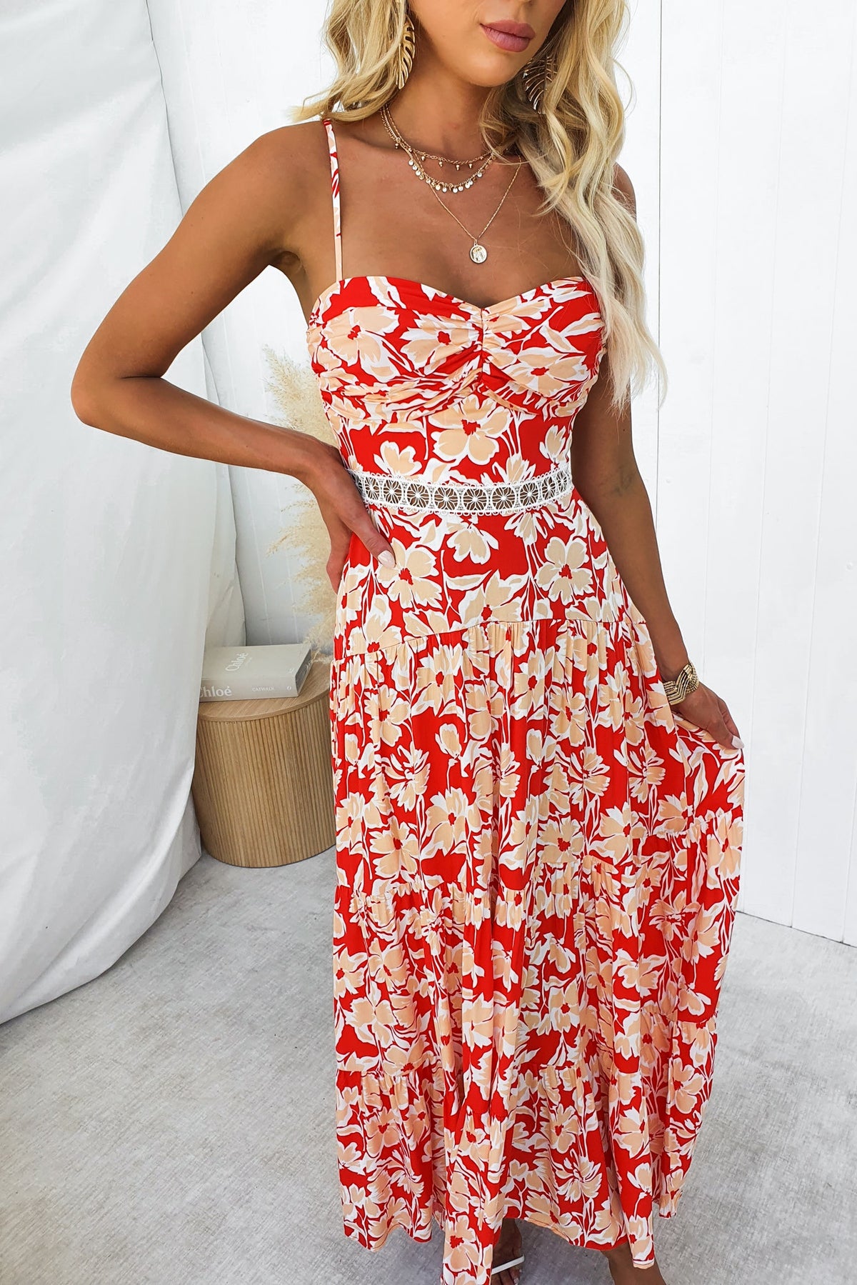 Vani Maxi Dress featuring adjustable straps, floral print, and lace detail, perfect for summer occasions.