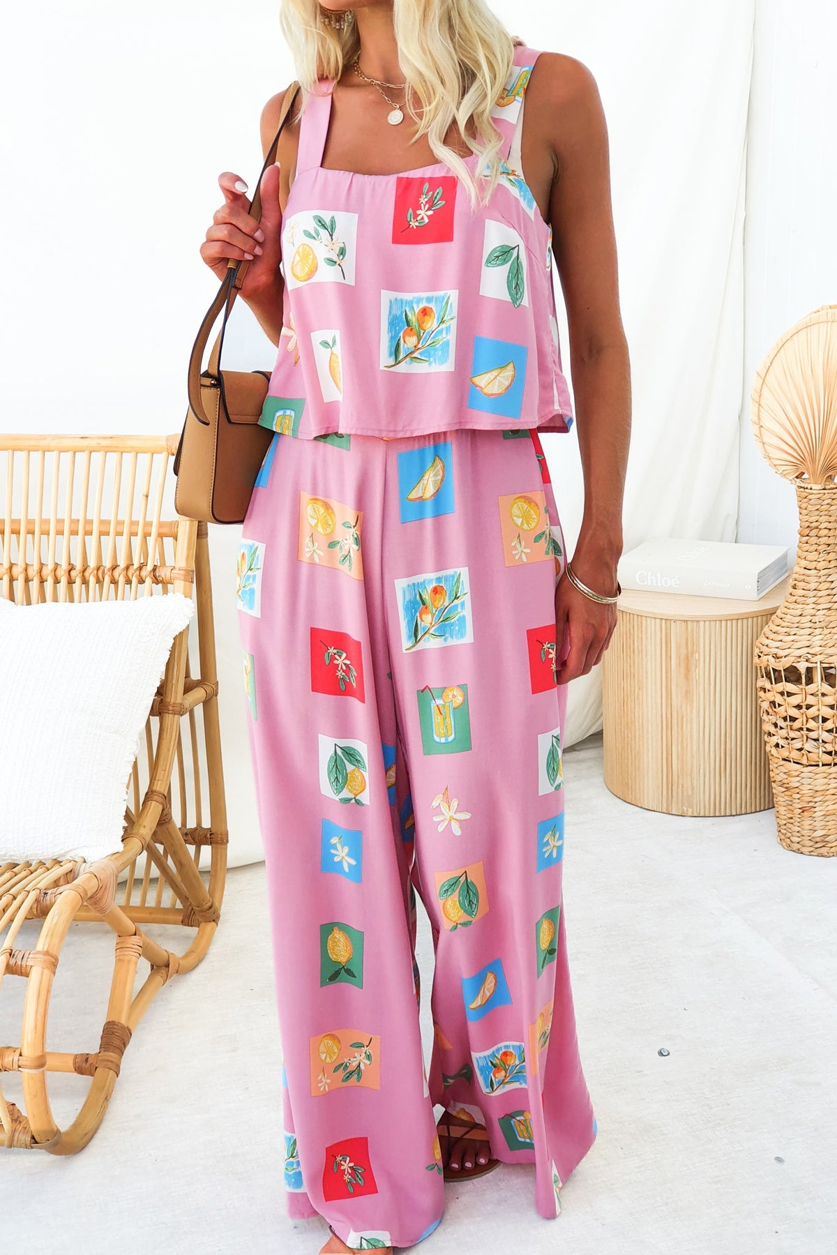 Verko Jumpsuit featuring abstract print in pink, with pockets, elastic waist, and a relaxed fit, perfect for summer outings.