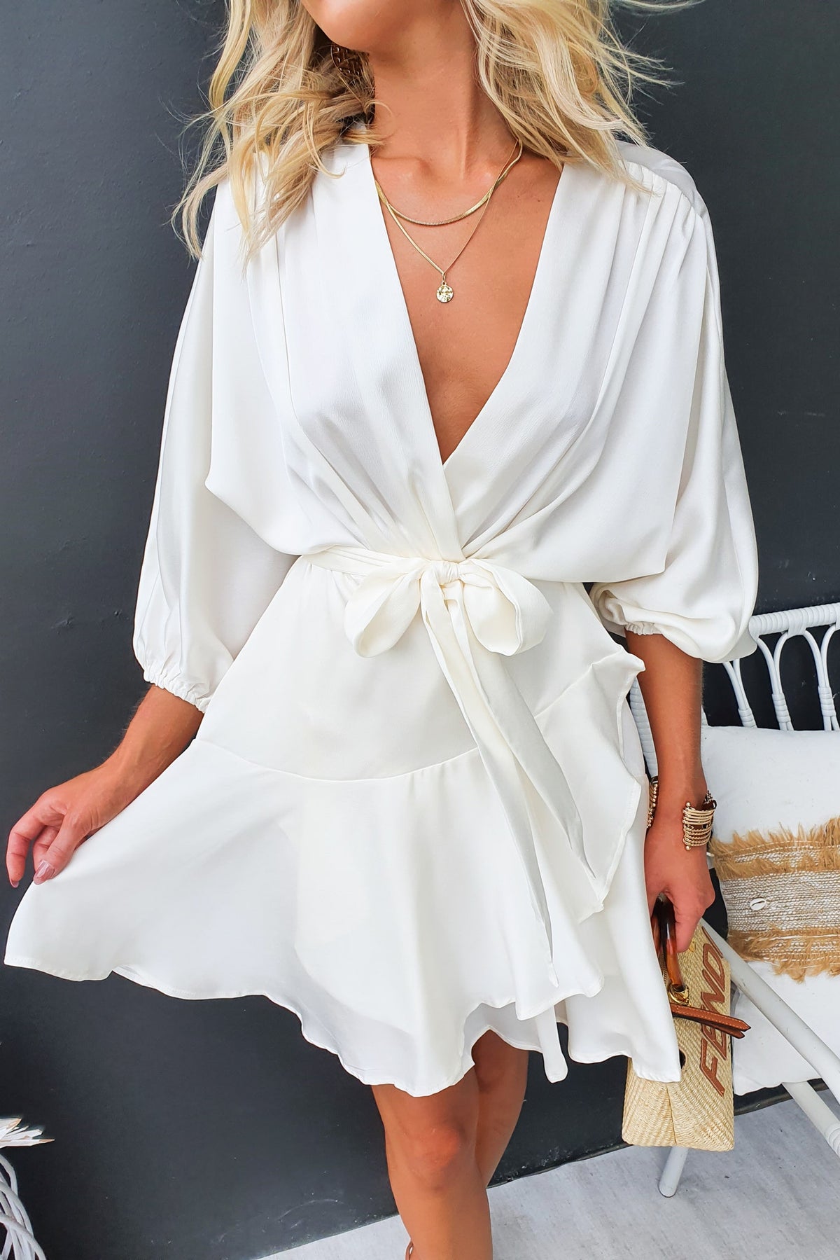 Stylish Xention dress features a V-neckline, batwing sleeves, and a removable belt, perfect for a chic look.
